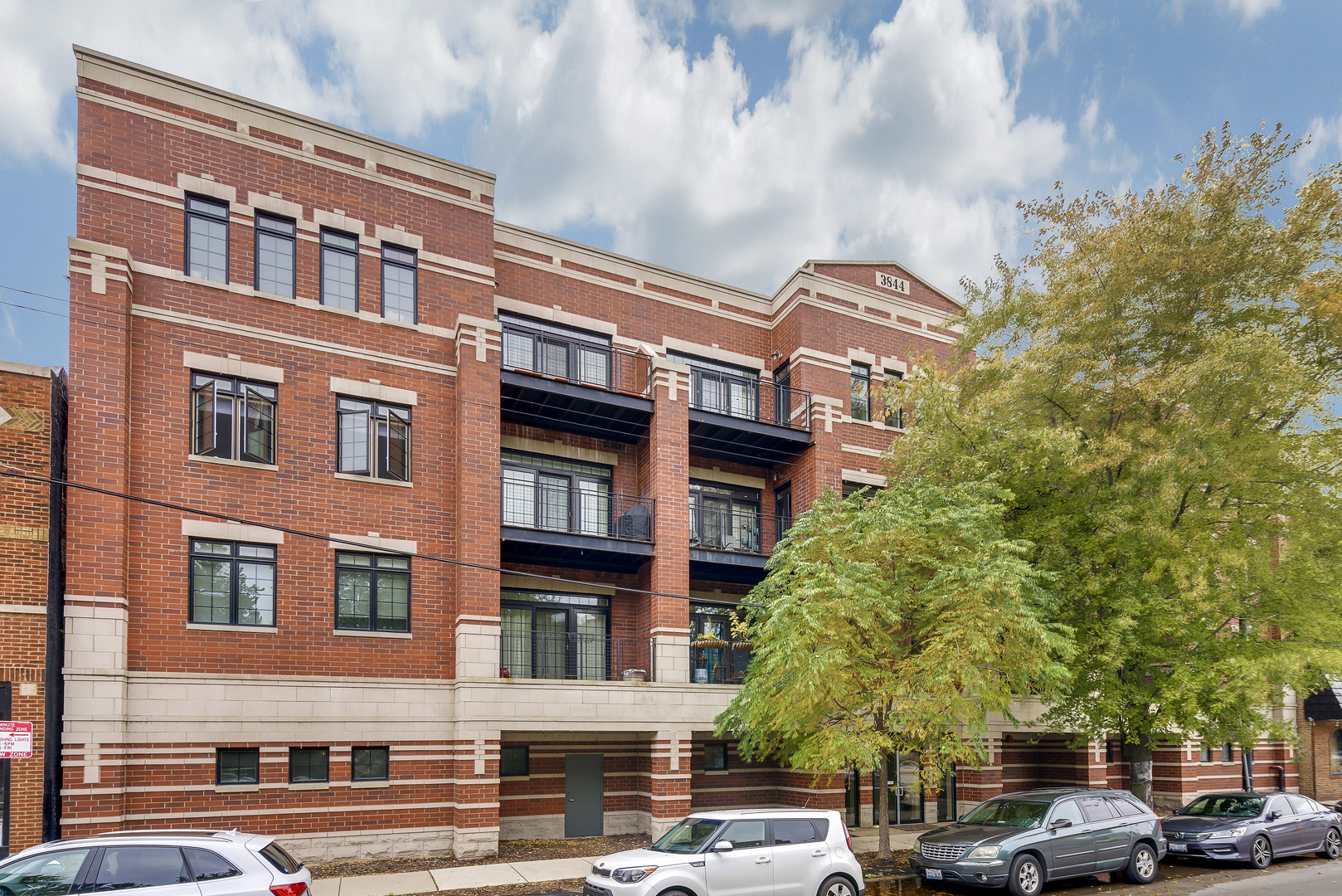 Everything you need in a stylish Lakeview condo INCLUDING 2 garage parking spots! This extra-wide, sun-soaked home features a smart split-bedroom layout and a spacious, open-concept living area with hardwood floors, recessed lighting, and a private balcony right off the living room-ideal for relaxing or entertaining. The kitchen is modern and thoughtfully designed, featuring quartz countertops, striking tilework, and stainless steel appliances, including a brand new fridge (2024). The HVAC system was also replaced in 2024, offering peace of mind and efficiency. The primary suite features an en-suite bath with a double vanity, ample storage, and a sleek glass walk-in shower with designer tile. Located in a well-kept, amenity-rich ELEVATOR building with a newly updated common roof deck, theater room, and TWO GARAGE PARKING SPACES INCLUDED. Set in a prime Lakeview location with easy access to transportation, grocery stores, dining, shopping, Wrigley, and the Southport Corridor.