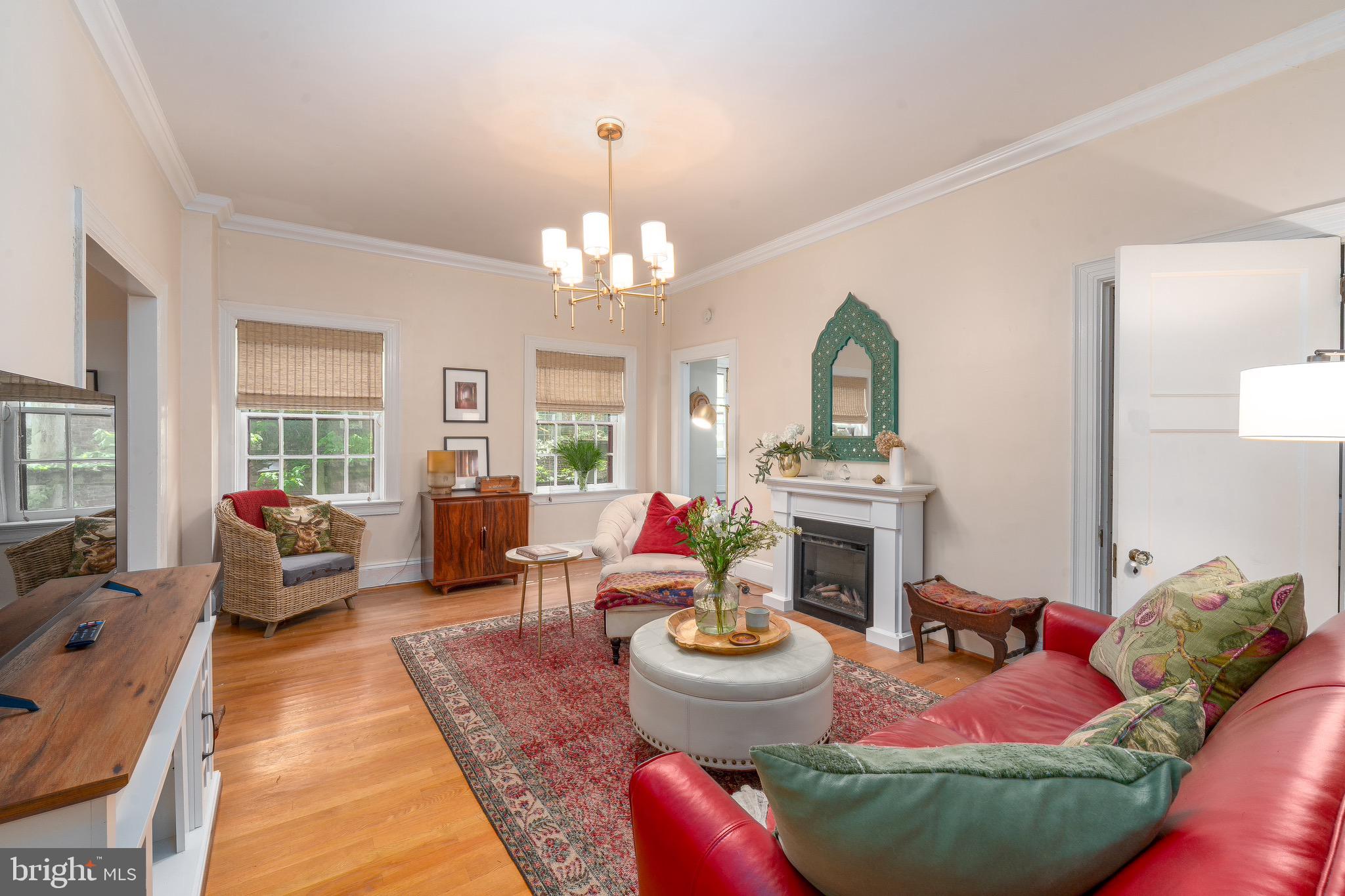 Tucked into one of Baltimore’s most beloved and architecturally rich enclaves, this rare residence at 230 Stony Run Lane offers a lifestyle that feels worlds away from the city, while keeping everything you love within easy reach. Set among mature trees, winding paths, and timeless courtyard buildings, Unit 4G blends old-world charm with the ease of condo living in the coveted Gardens of Guilford/Tuscany-Canterbury corridor.Inside, sunlight pours through oversized windows and highlights warm hardwood floors, gracious room proportions, and a floor plan that lives like a home rather than a typical apartment. The expansive living room is equal parts refined and comfortable, anchored by a fireplace and framed by treetop views. A true dining room invites dinner parties, holiday gatherings, or slow Sunday brunches. The large kitchen offers generous workspace, everyday dining potential, and rare in-unit laundry. A flexible bonus room creates the ideal office, studio, reading retreat, or guest overflow space.The bedrooms are privately positioned and generously scaled, creating a quiet retreat from the main living areas. Every room carries a sense of calm, character, and thoughtful function.What makes this home truly special is the life beyond the walls. Morning walks along Stony Run Trail. Coffee in Roland Park. Evenings at local favorites on Charles Street. Easy access to Johns Hopkins, Loyola, Notre Dame, The Rotunda, Hampden, and downtown. This is the kind of neighborhood people move to and stay for decades because it simply feels good to live here.For the buyer who values beauty, serenity, space, and location, Unit 4G is more than a home. It is a daily lifestyle upgrade in one of Baltimore’s most enduring settings.