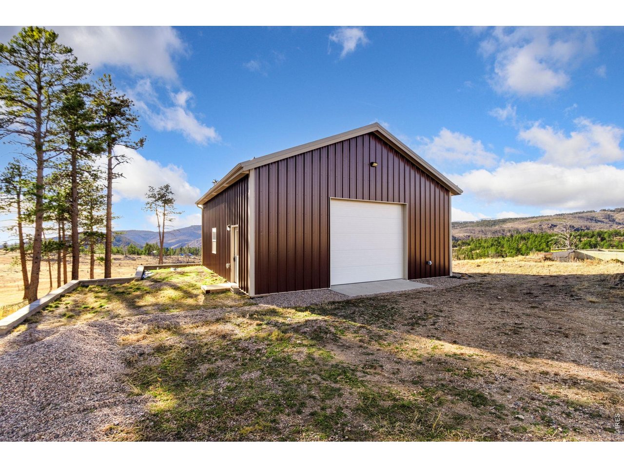 Kittle Real Estate presents over five acres of pure Colorado beauty with sweeping views of Redstone Canyon! Take in a landscape that looks straight out of a painting, with rolling terrain, striking rock outcroppings, and tall Ponderosa pine trees that surround the property, giving it a peaceful, park-like feel with texture and character at every turn. Already in place is a 960-square-foot heated shop featuring a 12' x 10' overhead door and a 12' ceiling, ideal for equipment, projects, storage, or a future base of operations while building your dream mountain retreat. Unmatched stargazing right from the homesite, with minimal light pollution and wide-open views. Key utilities are already in place and have recently been inspected for peace of mind, including a well, septic system with leach field, propane, and electricity. Portions of the existing foundation are also usable, and the seller has engineering and architectural plans available, giving you a valuable jump start toward making this property your own. Start building your ideal home, complete with breathtaking nature views and frequent wildlife sightings, all while staying close to everything Fort Collins has to offer.