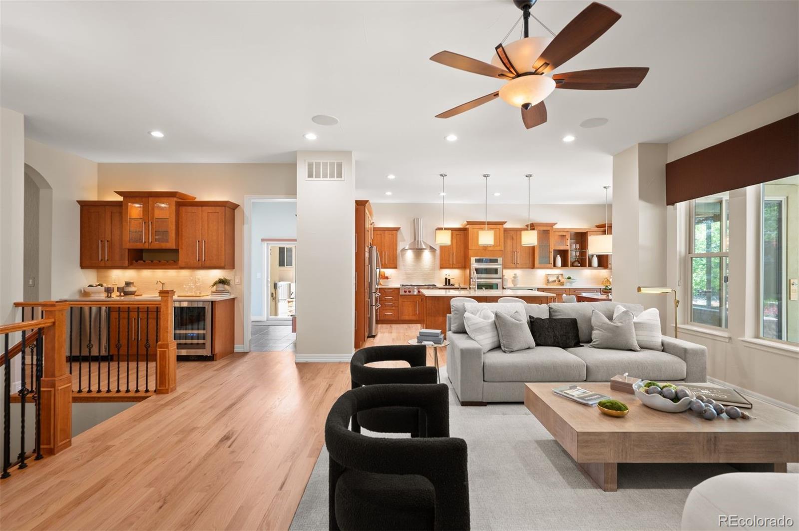 Welcome to Orchard Park, a gated community where quality craftsmanship, thoughtful design, & effortless main-level living come together in this exceptional patio home. Mature landscaping, meticulous upkeep, & inviting curb appeal create an impressive first impression.Inside, rich hardwood floors extend throughout the bright, open main level, seamlessly connecting the family room, dining area, & kitchen. Designed for everyday living & entertaining, the kitchen features stainless steel appliances, a Wolf range, abundant cabinetry, spacious breakfast nook, & butler’s bar ideal for hosting.The thoughtfully designed main level features a private primary suite w/ spacious bath, soaking tub, oversized shower, & dual walk-in closets. A dedicated home office, secondary bedroom w/ en-suite bath, laundry room, mudroom, & powder bath add comfort & convenience.The finished basement offers even more room to relax & entertain, featuring a generous recreation area w/ gas fireplace, full bar, 2 additional bedrooms, full bath, & ample storage. Large window wells bring in natural light, creating an inviting lower level ideal for guests, hobbies, or movie nights.Outside, the private backyard is designed for low-maintenance enjoyment w/ artificial turf, a covered patio, & built-in barbecue—equally suited for entertaining or quiet evenings outdoors. The oversized 3-car garage adds exceptional functionality w/ custom cabinetry & an epoxy-coated floor.Residents enjoy convenient access to the High Line Canal, while shopping, dining, & entertainment at The Streets at SouthGlenn are just minutes away. Easy access to the Denver Tech Center & Cherry Creek provides an ideal balance of privacy & connectivity.Combining timeless finishes, versatile living spaces, an ideal floor plan, & a sought-after location, this Orchard Park home offers an exceptional opportunity for refined, low-maintenance living.