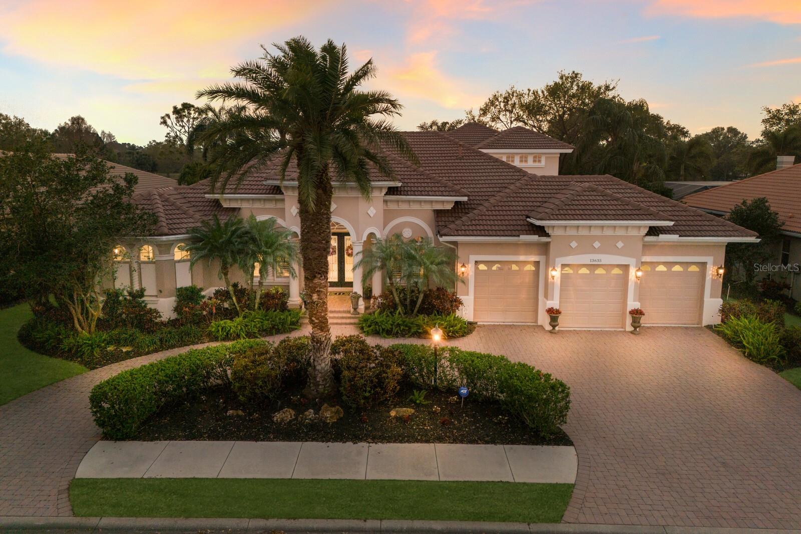 This stunning custom-built Peregrine home is perfectly positioned on one of the most sought-after homesites in Lakewood Ranch Golf & CC! Located on the Arnold Palmer designed Cypress Links #7, it offers breathtaking golf & water views. From the moment you arrive, the impressive curb appeal, circular drive & lush landscape set the stage for the elegance that awaits. Beautiful double glass doors open into a bright & welcoming foyer guiding you to the main living spaces. To the right, you'll find the formal dining area -perfect for hosting elegant dinners & to the left, a private office with French doors, hardwood floors & custom built-ins. Designed for both comfort & sophistication, the living room features a cozy fireplace, tray ceilings & a wall of sliders that draw your eye to the picturesque outdoors. A butler’s pantry with ample storage seamlessly connects the dining room to the newly remodeled kitchen, offering both style & functionality. It features an abundance of solid wood cabinetry, new backsplash, stainless appliances, granite countertops, double ovens, a breakfast bar & a spacious walk-in pantry. It also includes a charming eat-in area with a large aquarium window, offering the perfect spot to enjoy a morning coffee. Off the kitchen, the great room is an inviting space for family gatherings with built-in entertainment wall, tile floors, crown moldings, tray ceilings, architectural niches & sliders that bring the tropical outdoors in!  At the rear of the home, a generous sized bonus room (currently used as a home gym) provides endless possibilities & is located next to a convenient pool bath. The luxurious primary suite offers a private retreat with a serene sitting area & windows that frame the amazing views. The recently remodeled ensuite bath is a true spa-like escape, featuring double quartz vanities, a huge walk-in shower & an elegant soaking tub. There are TWO walk-in closets with extensive built-in cabinetry providing ample storage, while glass block windows fill the space with natural light. The home’s 2nd & 3rd bedrooms share a beautifully remodeled Jack-and-Jill bath with dual quartz vanities, seamless glass shower doors & new fixtures. Both bedrooms exude charm with hand-scraped wood floors, built-in window seats & walk-in closets with custom storage solutions. A beautiful hardwood staircase leads to an incredible second-level bonus suite, ideal for an in-law arrangement or private guest retreat. This space features a spacious living area with blackout blinds, a wet bar with fridge, a 4th bedroom & a full bath! A large 2nd floor screened-in balcony offers a peaceful place to sip a glass of wine while overlooking the tranquil natural surroundings. Designed for Florida’s coveted indoor-outdoor lifestyle, this home boasts an expansive outdoor space with 2 covered areas adorned with cypress ceilings, perfect for relaxing or dining al fresco. A stunning heated pool with sun deck & spa create the ultimate backyard oasis. Bonus of a 3-car garage offering ample storage & epoxy flooring. LWR Golf & CC offers Social, Athletic & Golf memberships which are all OPTIONAL. These include FOUR 18-hole championship courses, a state-of-the-art fitness center, a junior Olympic pool, tennis, pickleball, dining, social activities year-round & MORE! Enjoy close proximity to endless shopping, incredible restaurants, vibrant arts, easy access to I-75, top-notch healthcare, A-rated schools & our award-winning area beaches!