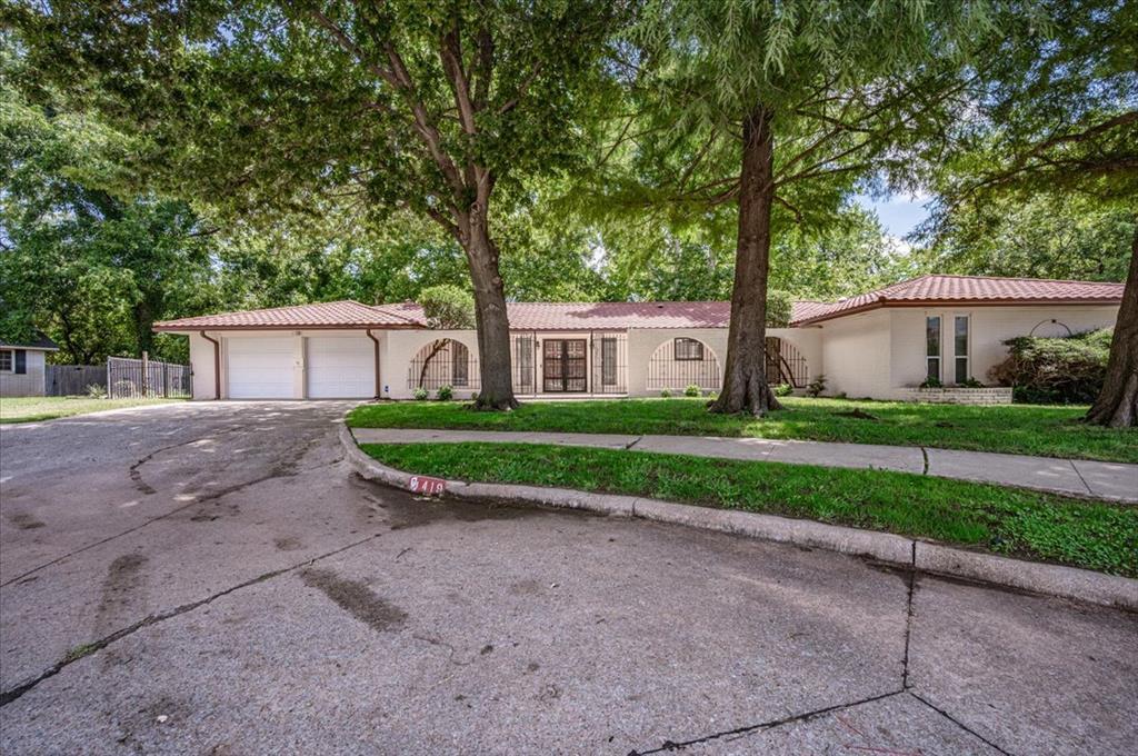 Welcome to this beautifully updated home nestled on a quiet **cul-de-sac**, offering comfort and convenience. This spacious 4-bedroom, 2.5-bath residence features a **2-car garage** with an **in-ground storm shelter**, plus a meticulously maintained courtyard surrounded by **mature trees** for added privacy and charm. Step inside to discover thoughtfully selected upgrades, including **updated LVP flooring**, **refinished hardwood flooring**, and updated **interior paint**. The galley kitchen offers **double ovens**, **stainless steel appliances**, ample cabinetry, and pantry spaces. Additionally there is abundant **built-in storage** found throughout the home in several bedrooms and in the study. A dedicated **study/office** provides the perfect space for working from home. The luxurious primary suite offers a spa-like retreat with **dual sinks**, a **jetted tub**, and an expansive **walk-in shower** featuring **body jets**, a **rain shower head**, and a **handheld sprayer**. Additional highlights include a striking **Gerard 26-gauge Stone-Coated Spanish-style metal roof (2018) **, **dual-zone HVAC**, a **whole-home generator** with maintenance records, and **updated plumbing** updated electrical panel**, ensuring peace of mind for years to come. The backyard is an outdoor oasis with **lush grass**, a full **sprinkler system**, **mature trees**, and **two storage buildings**—perfect for hobbies, tools, or extra workspace. This property seamlessly combines modern upgrades with timeless appeal—don’t miss your chance to make it your next home!