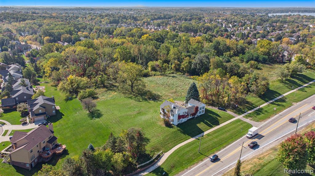 AS-IS MUST SELL.  5 developable acrea including a rehabbed 3400 sq ft, 4-bedroom, 3 full bath home. Zoned R-4 with Special Purposes Zoning qualifications offering any number of possiblilities: A family compound of large SFR homes or 11+ detached condominiums (3+ with walkouts).  Start a Church, Synagogue, Mosque, Temple or similar place of worship in the 3400 sq ft. home and develop a faith-based campus with a new worship center, open a private Charter or Montesorrri school, an adult daycare facility. It's your palette to work with. Review the pictures, walk the land and decide. Seller Financing available. Owner wants this property sold: Bring in a negotiable offer. Owner financing available.