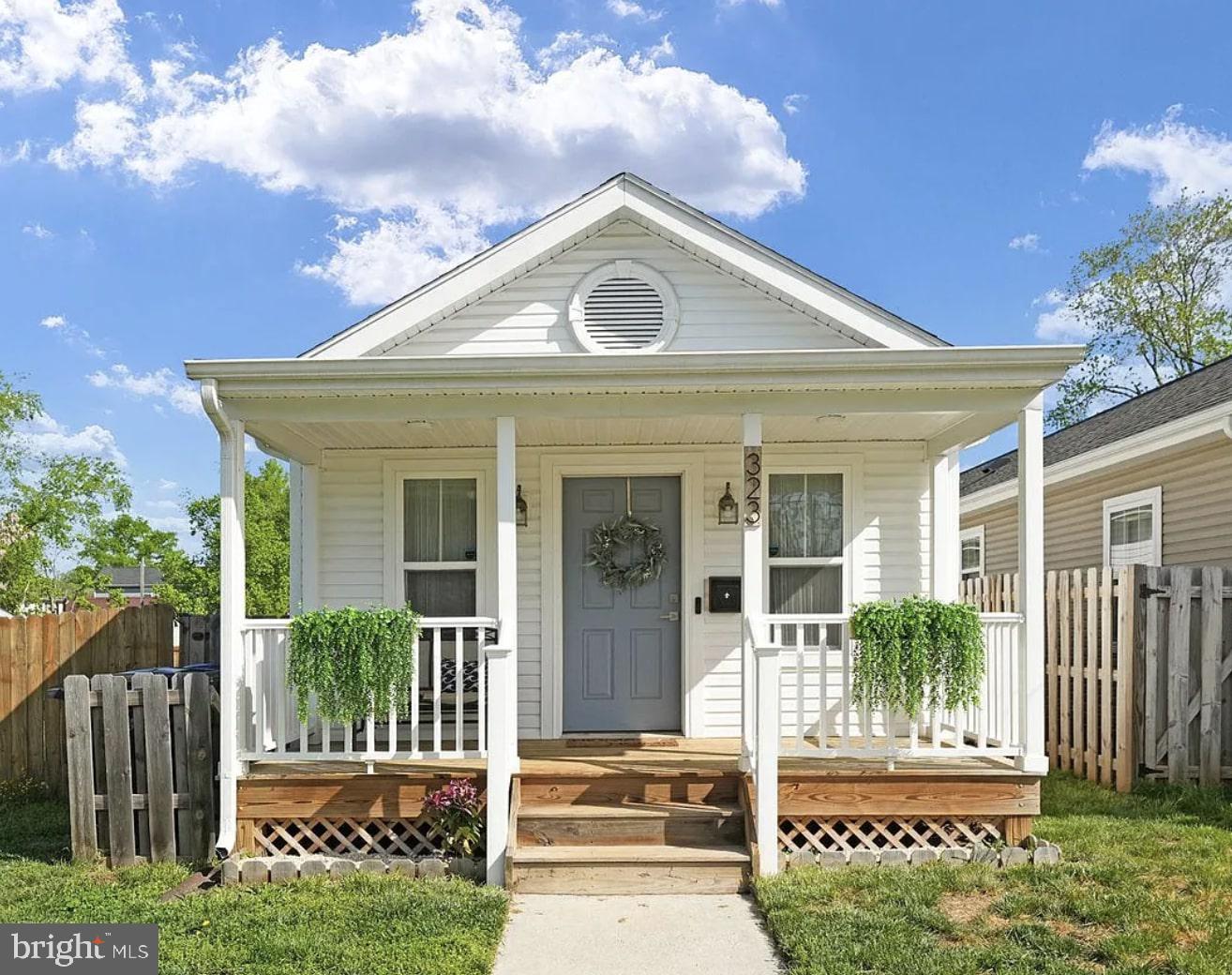 A Smarter Home for Modern Living, Steps from Downtown Fredericksburg!Built in 2019 and meticulously maintained, this charming 3-bedroom, 2 full bath home delivers modern efficiency with timeless curb appeal in one of Fredericksburg’s most walkable neighborhoods. The welcoming covered front porch sets the tone, leading into a bright, open interior featuring wide plank hardwood-style flooring, recessed lighting, and an easy, flowing layout designed for everyday living. The galley-style kitchen showcases warm wood cabinetry, stainless steel appliances including a gas range and built-in microwave, sleek countertops, and a tile backsplash that adds texture and polish, all seamlessly connected to the main living space for effortless entertaining. Each bedroom offers generous natural light, ceiling fans, and flexible layouts, including a standout room with a stylish green accent wall that adds character without overwhelming the space. Both full bathrooms are clean and contemporary, featuring modern vanities, updated fixtures, and a tub-shower combination with built-in shelving. A dedicated laundry area with a full-size washer and dryer adds convenience, while the fenced backyard provides privacy and functionality with room to relax, garden, or entertain. Additional highlights include a concrete foundation with exterior access, efficient systems, and a sense of pride of ownership throughout. Just steps from downtown Fredericksburg, enjoy easy access to local shops, dining, parks, and community amenities while living on a quiet residential street. A move-in-ready opportunity combining modern construction, excellent condition, and an unbeatable location.