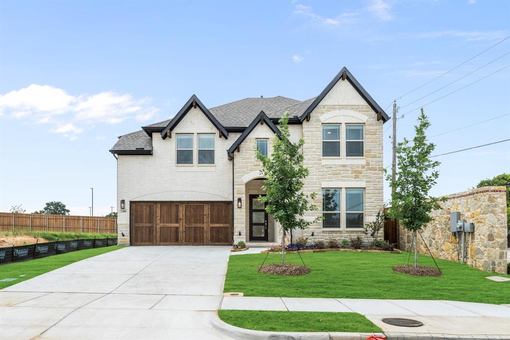 NEW! NEVER LIVED IN. Ready NOW. Live on a corner lot in Bedford's newest community, Grace Park, in a beautiful Bloomfield Homes Violet IV! Two-story with 5 bedrooms and 4 baths, smartly designed to give everyone their own zone while keeping the shared spaces central. The first impression starts outside with a brick and stone façade, buff mortar detail, and 4 exterior uplights that sharpen the look after dark, then shifts inside to a foyer that quickly branches into the home’s flexible front wing—Bedroom 5 is positioned as a true bonus space with a nearby full bath, perfect for a study setup, guest room, or hobby space. Past the entry, the plan opens wide - Engineered wood flooring carries through the central stretch of the home and straight into the family room where a fireplace rises with tile all the way to the ceiling. The kitchen doesn’t sit on the sidelines; it’s built to be part of the moment, with quartz countertops throughout, a large island with a deluxe cabinet finish, contemporary hardware, built-in stainless steel appliances, and pendant lights. A white gloss hex backsplash keeps the lines crisp, and the dining space is tucked close for easy hosting. The primary suite stays on the first floor for privacy, with a spacious bath featuring a separate tub and shower, upgraded finishes, and a walk-in closet. Upstairs changes the pace—game room at the center, media room set apart, and 3 secondary bedrooms supported by 2 full baths so the level functions smoothly day to day. Practical finishes round it out with tile flooring in baths and laundry, 2-inch faux wood blinds, a covered patio, and a 2-car garage. Give Bloomfield Homes a call to learn more about this special home!