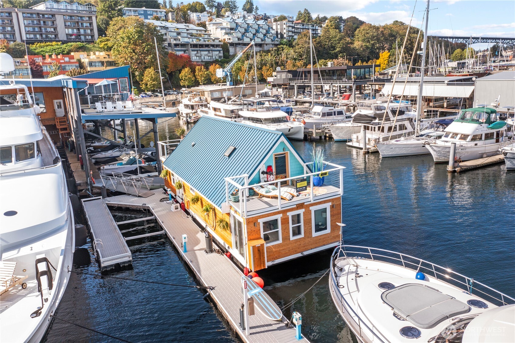 Exceptional Floating Home on Lake Union (FOWR #740) Renovated, this stunning 4-bedroom, 2-bath residence is perfectly moored on South Lake Union. The open-concept features a sunlit living room, modern kitchen with stainless steel appliances, and a spacious dining area. Enjoy serene waterfront living just minutes from Downtown Seattle, Fremont, and the University. Annual moorage lease $2,000/mo includes Electricity, Water, Trash, Secured Marina, Community showers+bathrooms, extra storage. Two decks surrounded by the best of water front lake life. Min to boutique shops, restaurants, and local charm- Feel a world away on the tranquil water lifestyle that is packed with premium amenities. On-demand water heater, skylights + in-unit washer/dryer