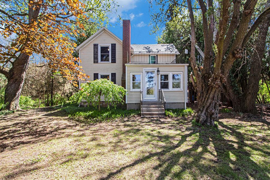 Charming 10-acre retreat offering peaceful seclusion and easy access to I-94, shopping, and downtown including a main house, guest house, pole barn, and garage. The main home features 3 bedrooms, 2 baths, and is filled with character: stunning wood floors on the main level, rustic pine upstairs, and a slate kitchen. Entry bathroom boasts slate floors and a tumbled limestone shower. The 1,800 sq ft guest house includes 3 bedrooms and 1.5 baths--perfect for multigenerational living. Guest house has a steam sauna and woodstove. A massive 6-car garage with EV charging and professional-grade heated workshop. The lot includes rolling hills and heart-shaped pond.
