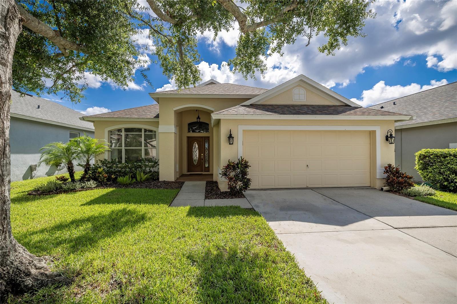 Looking for a home in the highly sought after Westchase area, you will need to check out this beautiful 4-bedroom, 2 bathrooms, 2-stall garage home. Low HOA and NO Flood zone.  As you enter this home you will be amazed by the beautiful water view of the pond in the back of the home. The breathtaking view is awesome.  You will notice right away the home has new luxury vinyl throughout the entire home. This home has an open floor plan with the kitchen opening to the dining room/family room.  Great space to entertain family and friends. There is also a breakfast area joining the kitchen with lots of natural sunlight coming in through all the windows.  There is inside laundry closet off the kitchen. The split bedroom plan offers a primary bedroom on one side of the home with a newly remodeled primary ensuite bathroom. All the upgrades make this bathroom one you won’t want to miss. There are two other bedrooms and a bathroom on the other side of the home. These make great kids' bedrooms or for in-laws or guests to stay in. The fourth bedroom can be used as an additional guest room or an office and is located at the front of the home. When you're ready to relax, you can step out into the screened in lanai and enjoy the pond views or sit in the spa and enjoy the peacefulness.  Roof 2019, Water Heater 2022, AC 2025. Westchase is a golf community featuring West Park Village – a town center with restaurant and retail establishments. It includes community pools, tennis/pickleball courts, two parks/playgrounds and miles of sidewalk trails. Easy access to the Veteran’s Expressway, Tampa International Airport, the Westshore Business District, and Pinellas County Beaches.