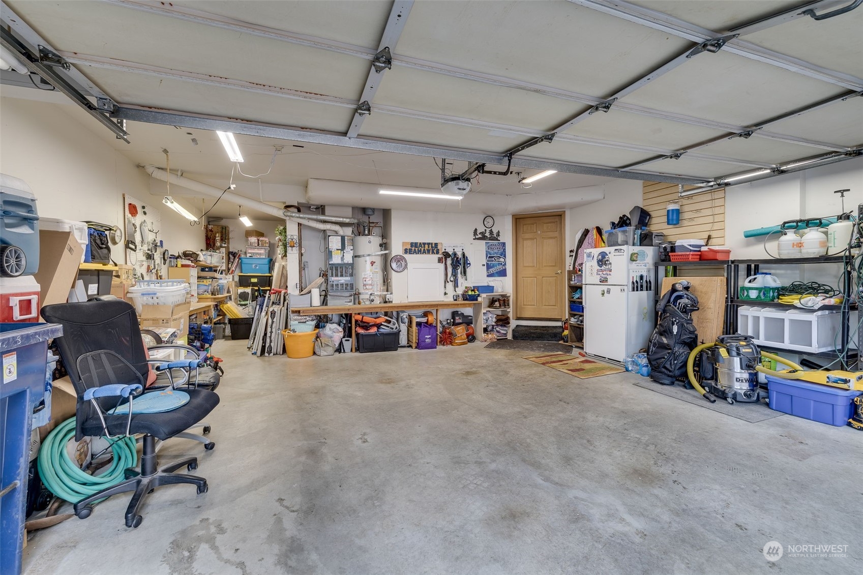HUGE Garages with Tons of extra storage and work bench. Mini Elevator that goes up to main floor (Dumb Waiter)