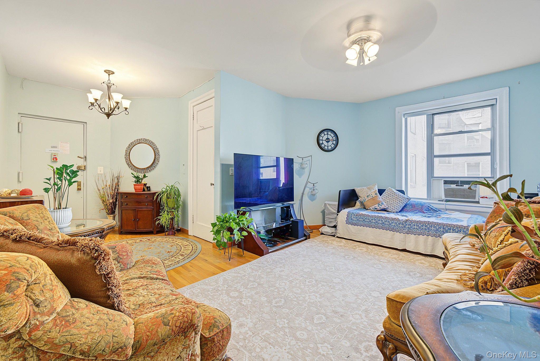 Bright and airy two bedroom, one bath co-op in a classic pre-war Sunnyside building, just steps from the 7 train. The ride into Manhattan is quick and easy, yet the apartment itself is quiet.Step inside to a huge, sun-filled living room with plenty of space to relax, dine, and have friends over.A hallway leads to the rest of the home. The first bedroom sits on your left. Next comes a separate, large eat-in kitchen, then a full bath, and past the bath, the second bedroom. Both bedrooms are large, and the layout keeps the living room apart from the private rooms.Built in 1922, this pet friendly building offers a common courtyard and a central laundry. Board requirements include a 35% debt-to-income ratio. Gifts are permitted, and guarantors and co-signers are allowed with conditions.Outside your door, you are close to great restaurants, cafes, shopping, and supermarkets along Queens Boulevard.