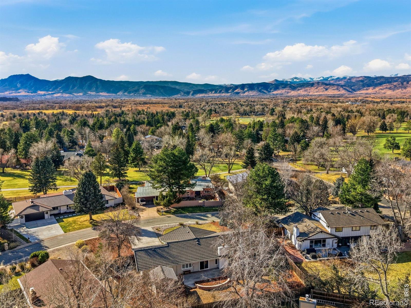 Thoughtfully reimagined, this fully renovated ranch blends contemporary design, exceptional functionality, and effortless everyday living in the sought-after Boulder Country Club neighborhood. Offering six bedrooms, four spacious bathrooms, and a desirable main-level primary suite, this home combines modern style with the ease of primarily single-level living. Large windows fill the home with abundant natural light, highlighting clean architectural lines, warm finishes, and an inviting open floor plan. At the heart of the home, the designer kitchen showcases an oversized island, premium gas range, farmhouse sink, and custom cabinetry, while a classic wood-burning fireplace in the adjoining sitting area creates a warm and inviting place to gather. The main-level primary suite is a private retreat with a spa-inspired bath featuring a freestanding soaking tub, oversized walk-in shower, dual vanities, and a spacious walk-in closet. A third main-level bedroom with its own ensuite bath offers exceptional flexibility as a guest suite or private home office. The expansive lower level adds a spacious recreation room, designer wet bar, three additional bedrooms, an updated bathroom, and a generously sized laundry room with a utility sink, along with flexible space for guests, movie nights, fitness, hobbies, or everyday living. Sliding doors open to an expansive deck overlooking a professionally landscaped yard with a lush lawn, raised garden beds, and a detached storage shed, creating a seamless indoor-outdoor connection for entertaining or relaxing. Located in Gunbarrel Green, residents enjoy easy access to Boulder Country Club, offering golf, tennis, pickleball, swimming, dining, and an active social atmosphere, along with nearby White Rocks Open Space, the LOBO Trail, parks, and shopping. Designed around today's lifestyle with timeless contemporary finishes, this move-in-ready home offers an opportunity to enjoy ranch-style living in the Boulder Country Club neighborhood.