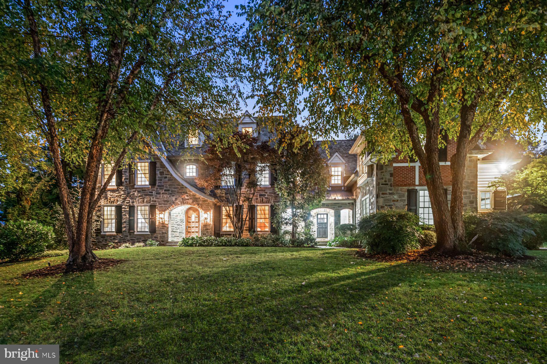 WOW!! This incredible custom-built "walk to Gladwyne" residence, set on a private acre, offers sun-filled rooms with high ceilings and an open flow, sophisticated decor, beautiful millwork and moldings, fabulous floors, designer fixtures and impeccable finishes throughout.  Move right in and enjoy the gracious front to back entry foyer, opening up to the inviting living and dining rooms with tall windows, beautiful floors and millwork, private rear study with new cherry floors and extensive custom crafted built-ins,  spacious, white gourmet kitchen with  custom cabinetry, large eat-in island and chef's appliances, convenient butlers pantry, adjacent breakfast room with 2 walls of windows featuring serene views of the private grounds, breathtaking family room with cathedral ceiling, hand crafted beam detail, built-ins and stone fireplace and convenient mudroom with back staircase leading out to the oversized 3-car garage. The stunning main staircase with new wainscotting detail leads up to an expansive second floor featuring a luxurious primary suite with sitting room, bedroom with trayed ceiling, two large walk-in closets with custom built-ins and a timeless white marble primary bathroom with tub, frameless glass shower and his and hers vanities, 4 additional large bedrooms with  3 additional full  bathrooms and a guest suite sitting room complete this floor. The bonus third floor offers a spacious sitting room, bedroom and full bathroom. The recently remodeled lower level with high ceilings includes a large exercise area, dramatic wine room, media/ game room, full bathroom and lots of storage. Walk to the charming town of Gladwyne which is about to enjoy expanded shopping, restaurants and more, all in close proximity to all forms of transportation, renowned Lower Merion and private schools, universities, Center City Philadelphia, clubs, endless recreational opportunities and more.