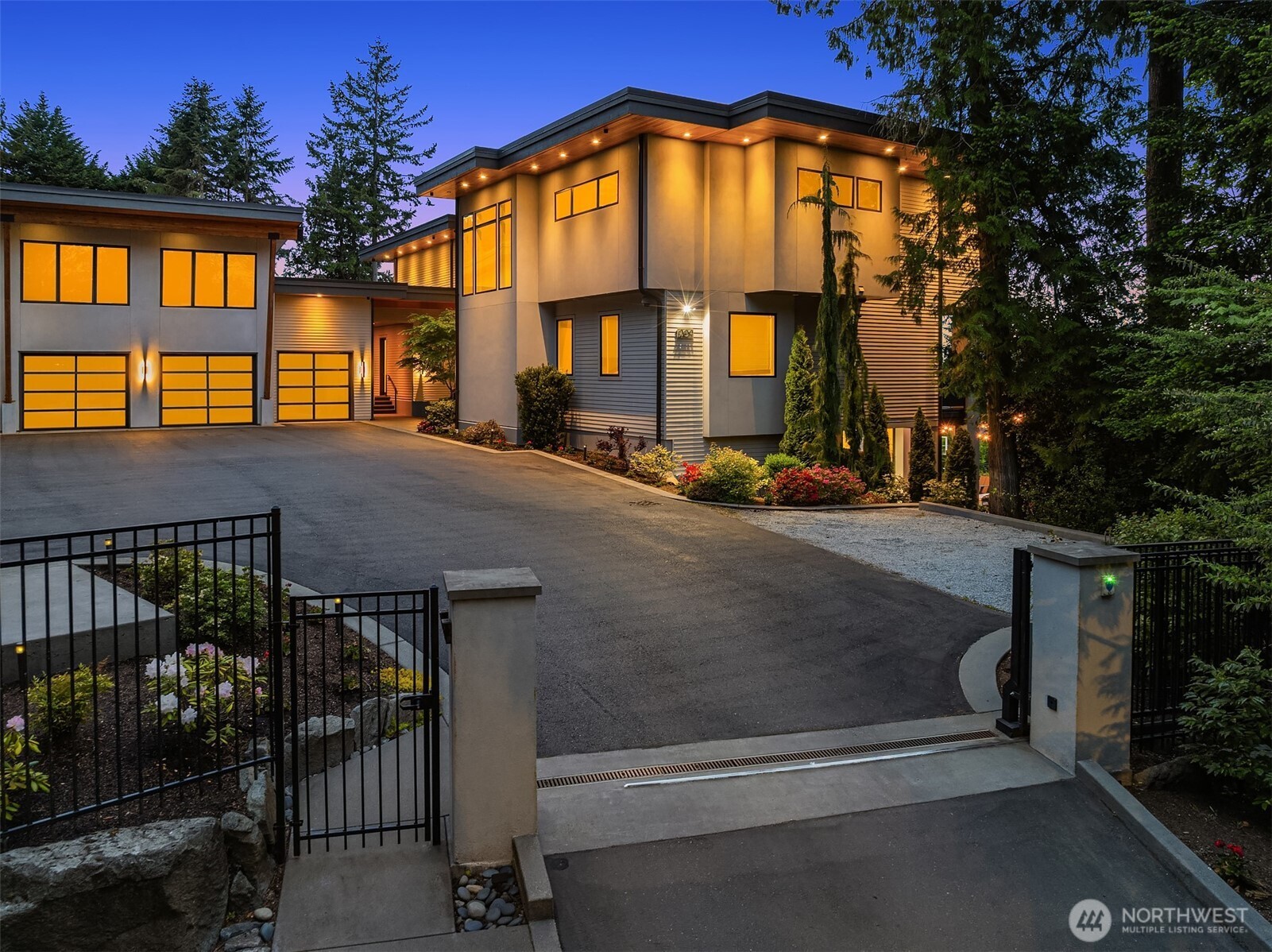 Experience modern luxury & panoramic views of Bellevue from this Extraordinary Estate just minutes from Downtown Bellevue. This residence is privately nestled behind a gated entrance & blends casual elegance with refined functionality. A dramatic two-story entry welcomes you to soaring ceilings & sun-drenched interiors. The chef’s kitchen flows seamlessly into the family room & out to a heated terrace with a built-in outdoor kitchen. Enjoy 7 en-suite bedrooms including a showstopping primary with marble bath, fireplace, bar, & stunning vistas. Entertain effortlessly in the lower-level party room, full bar, theater, & indoor-outdoor gym. Level grounds, sport court, 6-car garage, & access to community pool & tennis complete the lifestyle.