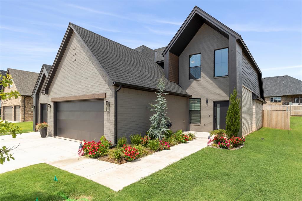 This beautiful modern home offers a smart, spacious layout that blends comfort, function, and style. This two-story home opens with a covered front porch leading into a bright entryway that makes a great first impression. Just off the entry, there’s a flexible room that works well as a home office, guest space, or whatever fits your needs. The main living area is open and welcoming, with the living room flowing right into the dining area and modern kitchen. The kitchen is designed for both everyday living and entertaining, with a large island that's great for casual meals or prepping food. You’ll also find a walk-in pantry and a nearby utility room for extra storage, plus a powder bath and a mudroom with direct access to the 3-car garage—super practical for everyday use. One of the best parts of the home is the primary suite on the main floor. The bedroom is spacious and tucked away for privacy, with a large bathroom that includes dual vanities, a soaking tub, a separate shower, and a walk-in closet. Even better? The closet connects directly to the utility room for added convenience. Upstairs, there are two more bedrooms, each with plenty of closet space, and a shared full bath. There’s also a generous bonus room that could easily be a media room, game room, home gym—whatever works best for your lifestyle. Outside, a covered back patio gives you a great space to relax or entertain, and the fenced-in yard is ready for pets, play, or outdoor gatherings. This is a well-thought-out home that feels just as good as it looks—ideal for anyone looking for a home that’s both beautiful and practical.
