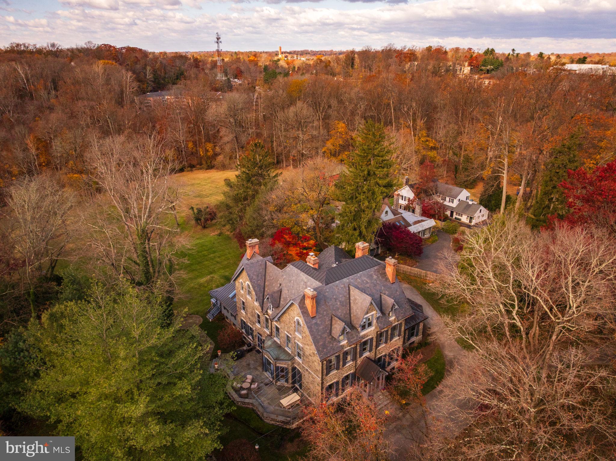 Rarely does a historic Main Line estate combine architectural pedigree, privacy, and refined modernliving as seamlessly as this extraordinary Villanova property. Originally built in 1880 and laterreimagined by renowned architect John Milner, “Willow Creek” is a character-filled residence that blendshistoric craftsmanship with thoughtful modern refinement. In recent years the home underwent acomprehensive renovation, where every system, finish, and architectural detail was carefully restored orrebuilt with exceptional attention to quality. Set on nearly four private, park-like acres with direct accessto the scenic Radnor Trail, the property offers a rare sense of serenity and space while remainingmoments from the heart of the Main Line. Craftsmanship takes center stage across 7,353 square feet offinished living space with soaring 10-foot ceilings. Magnificent millwork, beautifully proportionedrooms, and six original fireplaces create an atmosphere of timeless sophistication. A classicslate roof further underscores the property’s architectural integrity and the sense that this is a home builtto last for generations. The experience begins at the circular drive, leading to an elegant entrance whereintricate leaded-glass mahogany doors open into a grand foyer with a sweeping staircase and soaringceilings. Architectural details abound, from coffered ceilings and deep-set windows.The main floor offersa refreshed color palette, using light, modern hues that make the home feel bright and inviting. Justthrough the family room and butlers pantry/bar area, at the heart of the home is the chef’s kitchen,featuring custom cabinetry, a La Cornue range, and Sub-Zero refrigeration, supported by an impressiveButler’s Pantry. This space flows seamlessly into a vaulted Sunroom with dining space with a fabulousview to the back yard, exposed beams and skylights opening to a back porch with incredible views.Whether elegantly entertaining in the formal living and dining rooms, working in the incrediblewainscoted office or enjoying a quiet morning or evening in the sunroom, the home adaptseffortlessly. Front and back staircases lead to the upper levels where the home offers six bedrooms, fivefull baths and two half-bathrooms. The primary level includes two spacious primary-quality bedroomsuites, each with its own fireplace and beautifully appointed marble bathrooms. One suite features asoaking tub, walk-in shower, and dual vanities, while the second suite offers another elegant bath withsoaking tub and shower. A third full bedroom on this level provides additional flexibility for families. Alaundry room and powder room complete this floor.The third level offers two additional ensuitebedrooms, one of which includes a connecting sitting room, along with another bedroom served by a hallfull bath. A large cedar closet provides excellent storage, ensuring the home remains as practical as it isrefined.Beyond the interiors lies an unexpected treasure: an enormous, private backyard with maturelandscaping and sweeping views—a rare feature in such a prime location. Various porches and patios areperfect for al fresco dining and relaxation, while access to the Radnor Trail makes weekend walkseffortless. A detached three-car garage with a second level already plumbed for a bath offers exceptionalpotential for a guest suite, studio, or additional living space. The location is truly exceptional, offeringunparalleled convenience alongside top-ranked Radnor schools. Just moments from the SEPTA RegionalRail and with easy access to Amtrak, travel to Center City, New York City, or Washington, DC isremarkably effortless. Residents will enjoy close proximity to Villanova and Wayne’s vibrant shoppingand dining scenes, featuring boutique shops, cafés, and top-rated restaurants. This is Main Line living atits finest-historic character, urban-inspired sophistication, luxury updates, and generous outdoor space.