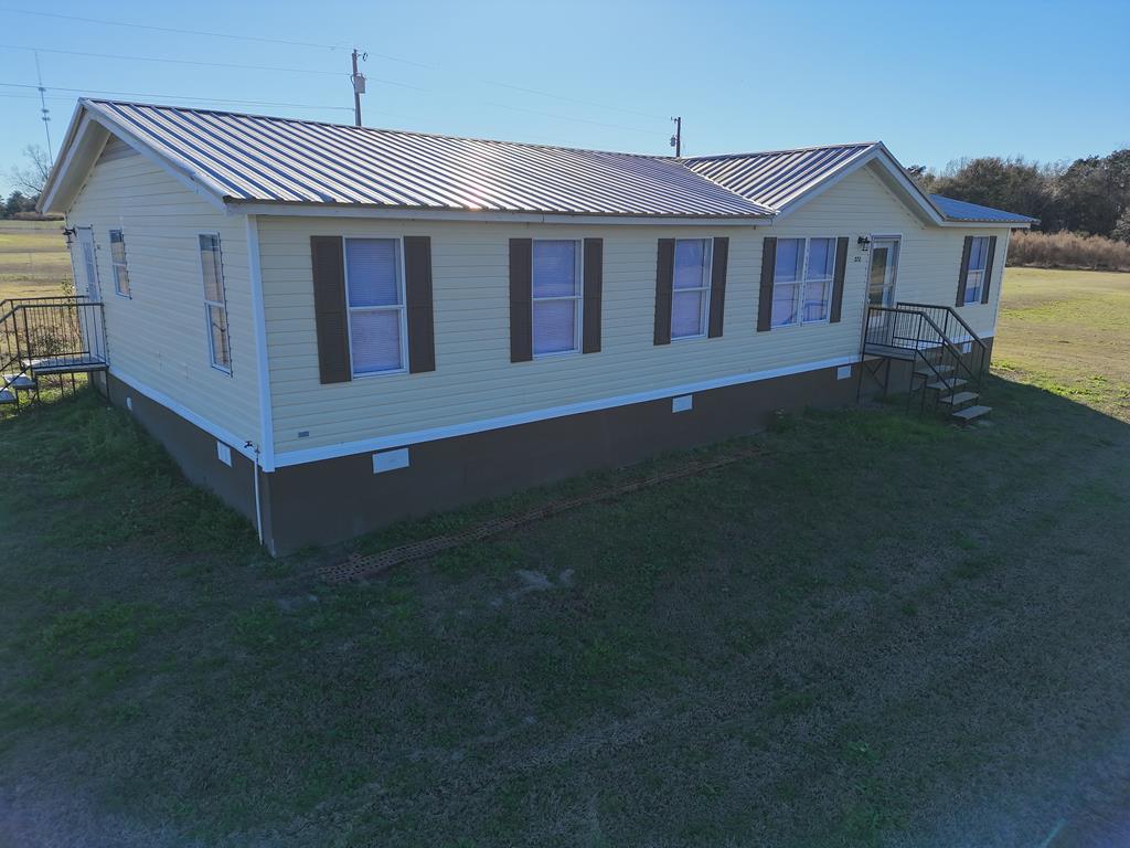 GREAT HOME, GREAT PRICE!! This 3BR/2 Bath mobile home sits on one acre - great scenic views. Home features wonderful open living space, a fireside den, huge kitchen, big primary suite with tub and shower, and can be yours today! Call your favorite agent for a closer look!
