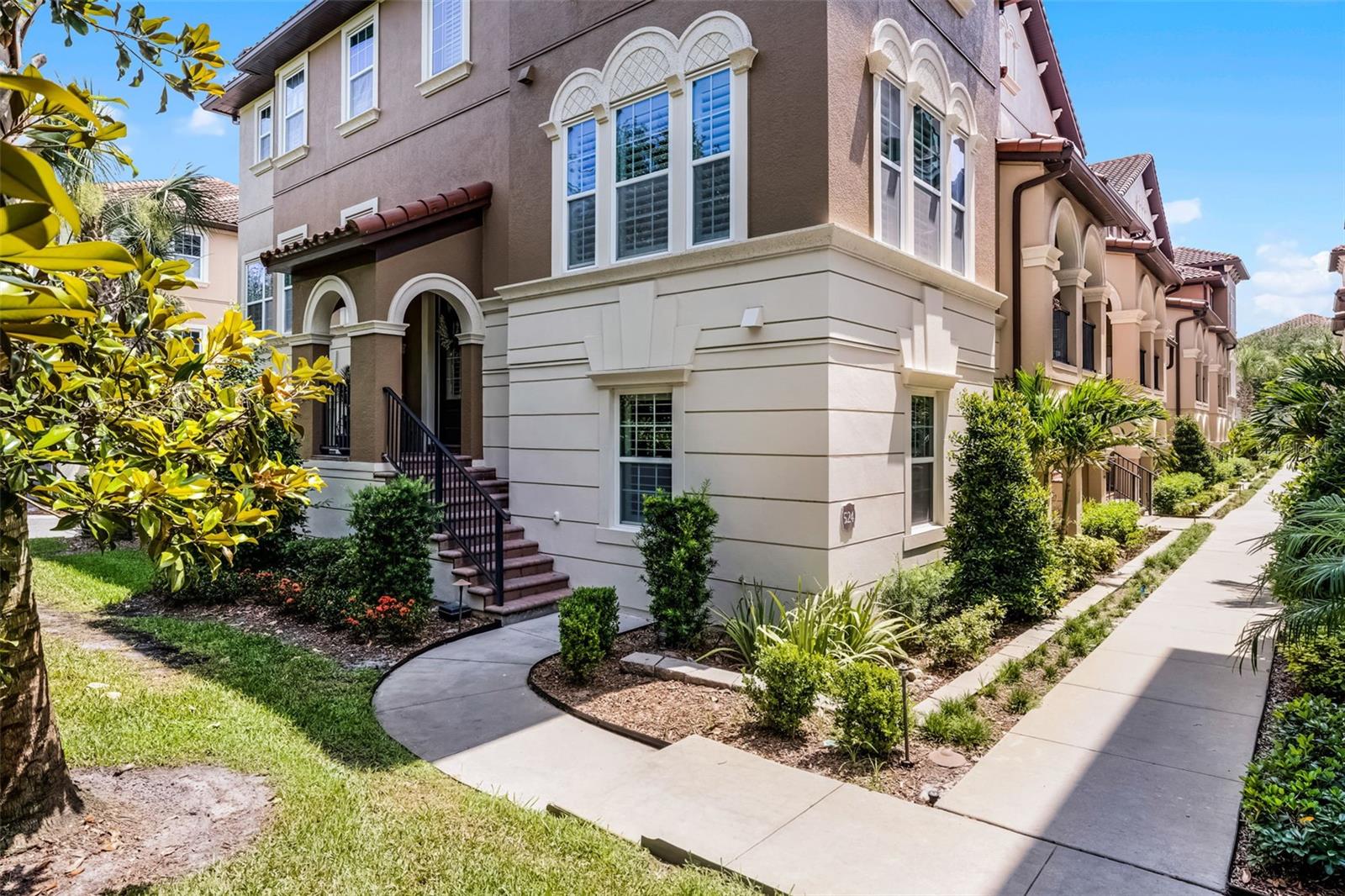 Luxury 3-Story End-Unit Townhome in Fountain Parke at Lake Mary! This beautifully upgraded 4-bedroom, 3.5-bath townhome is perfectly situated on a premium end-unit lot, bordered by a peaceful wooded landscape and showcasing stunning sunset views from the front. With custom features throughout, this home offers both comfort and style. The ground level features a spacious bedroom with a private en-suite bathroom—ideal for guests or a mother-in-law suite —along with newer luxury vinyl plank flooring, a convenient mudroom with closet, understairs storage, and access to the 2-car garage. On the main floor, you’ll find the formal front entry, a guest half-bath, a large living room with built-in cabinetry, a wine fridge, a slate tile accent wall with lots of natural light throughout. The open-concept layout flows into the dining room, sunroom, and a bright eat-in kitchen with glass cabinet doors and access to the screen-enclosed balcony through beautiful French doors with built-in blinds. Upstairs on the third level, the spacious primary suite features a stunning 17-foot extended walk-in closet with a California Closet system, dual showerheads, and upgraded tilework in the en-suite bath. Two additional bedrooms share a Jack-and-Jill bathroom, and the laundry area is conveniently located on this level. Notable Upgrades & Features: Whole-house intercom system, Plantation shutters on bottom two floors, Tall interior doors, Wainscoting and hardwood stairs, Upgraded kitchen countertops and backsplash, Custom living room built-ins, Granite and vessel sink in half bath, Closet systems in primary and one secondary bedroom, Premium location with wooded buffer and no front neighbors. Fountain Parke Amenities Include: 24-hour guard-gated entry, Clubhouse with social events, Olympic-size resort-style pool, Fitness center, Tennis/Pickelball courts, Putting green, playground, and dog park, Popular events like wine nights and food truck gatherings. All of this is just minutes from trails, parks, shopping plazas, dining, and the I-4 interchange. This townhome is a tranquil retreat in the heart of vibrant Lake Mary—come experience it for yourself!