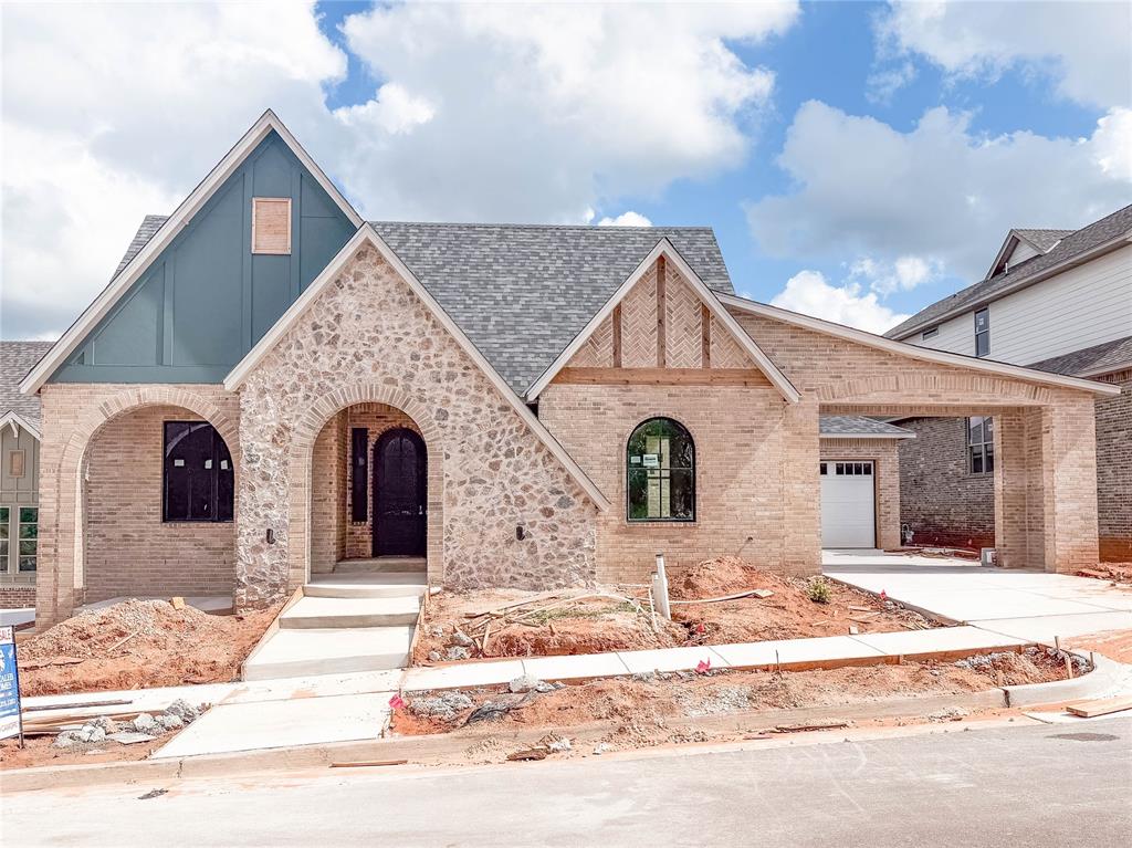 The Sycamore, offers 2,725 square feet of living space. This thoughtfully crafted home includes 3 spacious bedrooms, 3 luxurious bathrooms, a large formal dining, and a versatile study that could easily serve as a 4th bedroom. The bright and airy open-concept layout seamlessly flows with the gourmet kitchen to the dining area and into the living, which features a breathtaking stone-to-ceiling fireplace ad expansive windows that bathe the space in natural light. The chef's dream kitchen is equipped with quartz countertops, double ovens, granite composite sink, kitchen hutch and windows on each side of vent hood for stunning natural light. The lavish primary suite offers a relaxing free-standing tub, a spa-inspired glass shower, a double vanity and a remarkably large master closet that will leave you in awe. Currently under construction and expected to be complete Mid Fall 2026. Located in Bison Ridge, this home is part of a brand-new community inspired by Oklahoma’s natural beauty and history, with plans underway for a Modern Prairie-style clubhouse featuring a fitness center, youth recreation center, pool, playground, scenic walking trails, and a community lake with a fishing dock — creating a place where nature, history, and modern living come together.