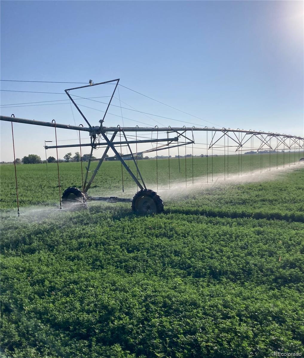 This premium 271+/- -acre irrigated hay and livestock operation, offered for the first time in nearly 30 years, presents a rare opportunity to acquire a productive, well-watered property in the highly regarded Swink School District. The farm is comprised of two large tracts, each featuring pivot irrigation, collection ponds, senior water rights, and dependable infrastructure. The North Farm includes 119+/- irrigated acres under a 2014 Zimmatic pivot and a 15-acre-foot collection pond. Water rights consist of 109 shares each of Catlin Canal and Larkspur Ditch. A conservation easement covers 64 acres and 64 Catlin shares, while 66 acres and 45 shares remain unrestricted. Two headgates—one gravity-fed and one pump-fed with a 12” Fischer lift pump—deliver water directly from Catlin Canal, eliminating lateral ditches. A domestic water tap supports winter cattle grazing. This farm has consistently produced premium alfalfa and grass hay, with yields averaging 5 tons/acre (grass) and four alfalfa cuttings annually. The South Farm features 141+/- irrigated acres under a 2018 Zimmatic pivot and a 10-acre-foot pond. It includes 120 Otero Canal shares and receives transferable Catlin water via a 12” underground pipeline. Concrete ditch and riser systems irrigate pivot corners. Re-seeded to alfalfa in 2024, this field averages 3 tons/acre historically. Both farms have a corn and wheat base and offer easy access from paved County Roads 24 and Z. Water assets include top-tier Catlin Canal shares (5 AF/share, 2.4 CU AF/share) with winter storage, Fry-Ark allocations, and augmentation/lease programs; Otero Canal shares (2.5 AF/share, 0.875 CU AF/share) with Fry-Ark access; and Larkspur Ditch transmountain water with no return flow obligations. With reliable water, strong yields, and long-term viability, this is an ideal setup for ag operators or investors seeking proven production and lasting value.
