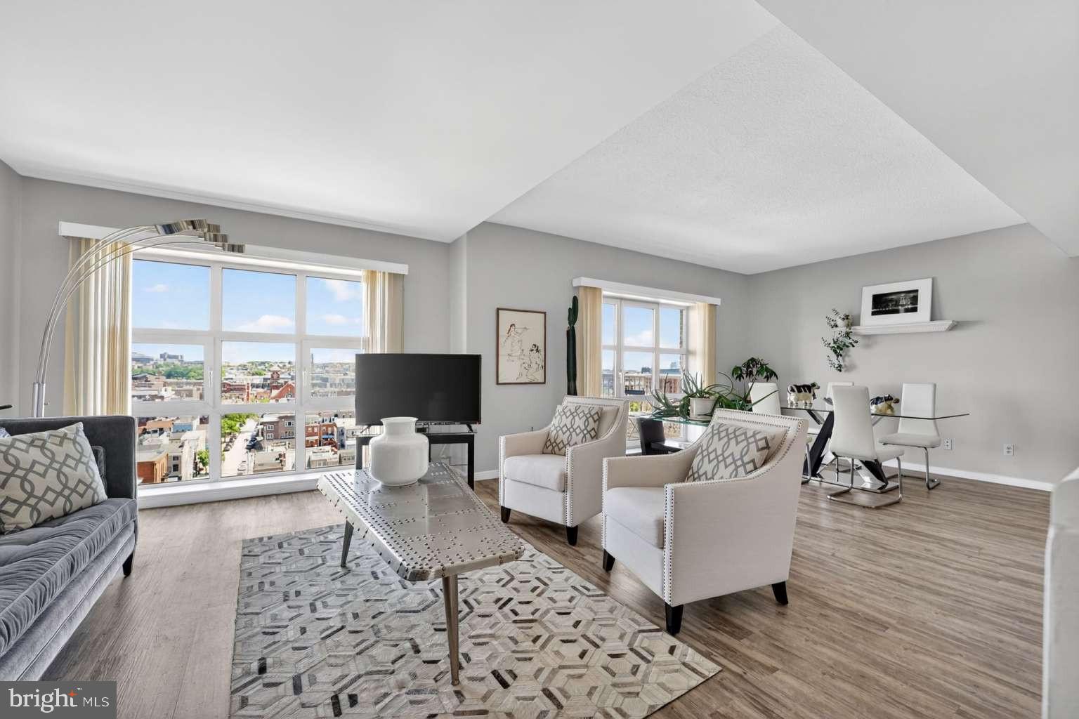 High floor Scarlett Place 2BR/BA condo, offers luxury waterfront living in the heart of downtown Baltimore, ideally situated between Little Italy and Harbor East with scenic harbor views and direct access to several family friendly parks, promenades, dining, shopping, and entertainment, Pier 6 open air concert pavilion, National Aquarium. This bright east-facing 2BR/2BA condo filled with an abundance of natural light, spacious at 1,457 sq ft features an open-plan layout with bedrooms positioned on opposite sides for added privacy, a private balcony, Italian marble entryway, updated seamless LVP flooring kitchen/dining/living area, modern kitchen appliances, adjoining living and dining areas, generous storage and one secure garage parking space.Residents enjoy exceptional communal amenities including a manned front desk, secure building access, wheelchair accessible, full service elevator access, resident lounge, 24/7 gym and heated indoor pool, harbor-view water side outdoor secure terrace with BBQ and lounge areas, and additional storage, secure garage.Recent condo updates include a 50 gallon fiber glass hot water heater, a large in-unit stacked washer/dryer, dishwasher and microwave. Seamless LVP flooring throughout kitchen/dining /living areas. Annually inspected and maintained CAC unit.The condo offers impressive views of Baltimore’s landmarks including the Phoenix Shot Tower, Johns Hopkins Hospital dome, and Patterson Park Pagoda to admire.