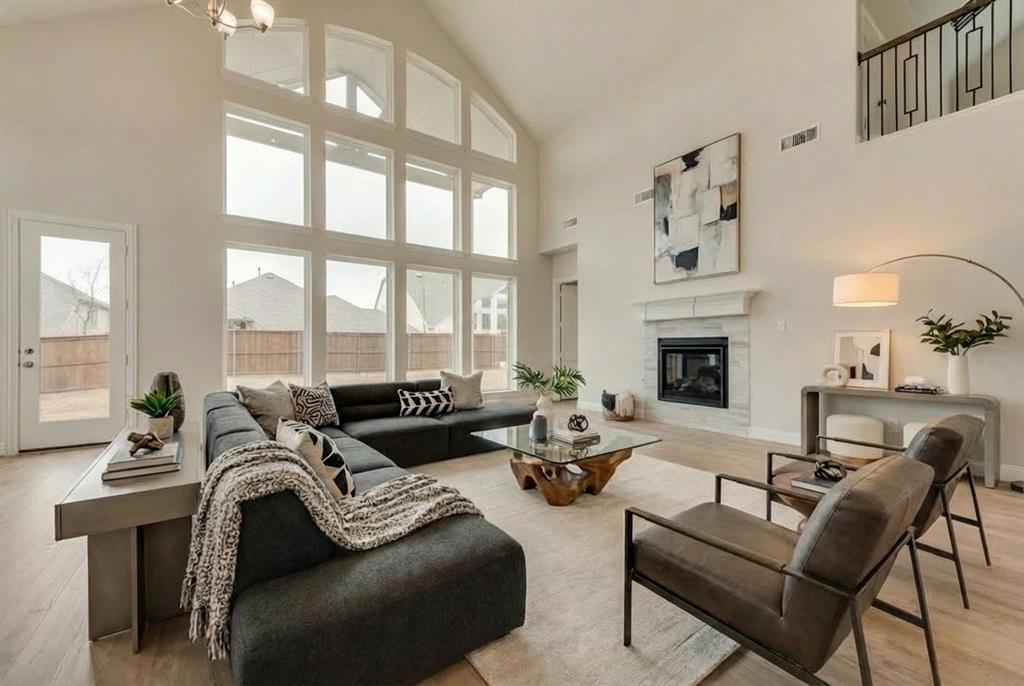 New Grand Home in Monterra - master plan neighborhood w swimming pool, splash pad, trails, basketball & pickleball courts! Sought after Rockwall ISD. 1 Block to pool & sport court. Modern white brick home. Sweeping curved staircase with wrought iron along upstairs. The Open concept family room has a wall of energy efficient windows, Wet Bar & a gas fireplace. Downstairs Media Room with French Doors - Formal Living, Den or Home Office. Upstairs Gameroom. Gourmet kitchen has island, Shaker cabinets, gorgeous slab countertops, stainless steel appliances, 5 burner gas cooktop, pots & pans drawers, trash can drawer, & walk in pantry. Custom features include 8 foot doors, wood floors, flat screen tv wiring, & thick trim. Primary Suite has a Free Standing Tub, glass shower w tile, rectangle sinks on separate vanities, & large walk in closet. Downstairs Guest Suite. Covered Back Patio has a gas line for BBQ & plumbed for a future sink & prewired for a fan. Convenient location w lots of shopping & dining options near Lake Ray Hubbard. Energy Star Partner w R38 & tankless water heater.
