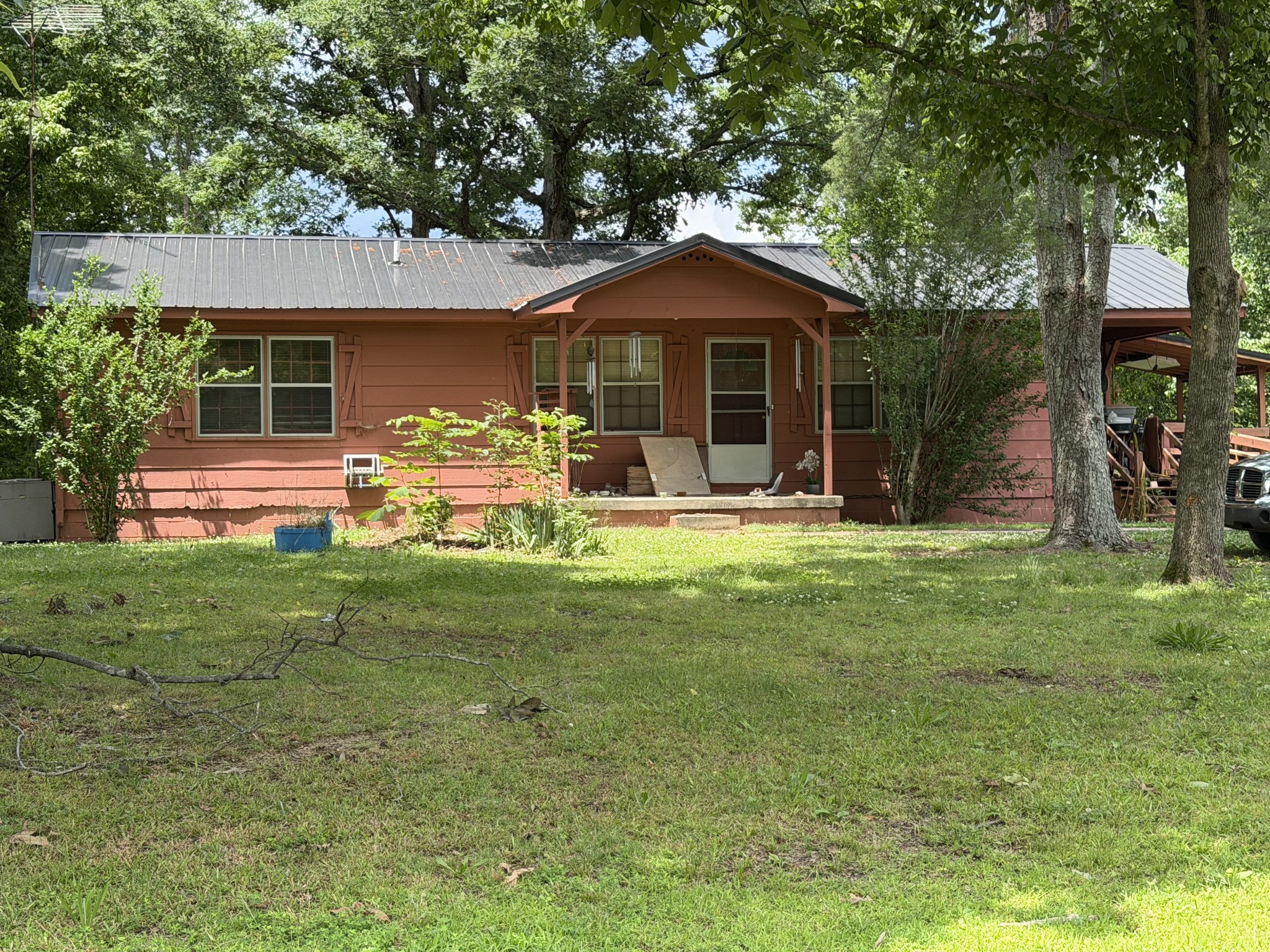 The home has 1058 sq ft, full basement, large covered deck with ramp and covered front porch. We will sale the home and reserve the right to regroup with 10.84 adjoining acres which sale at Auction also.