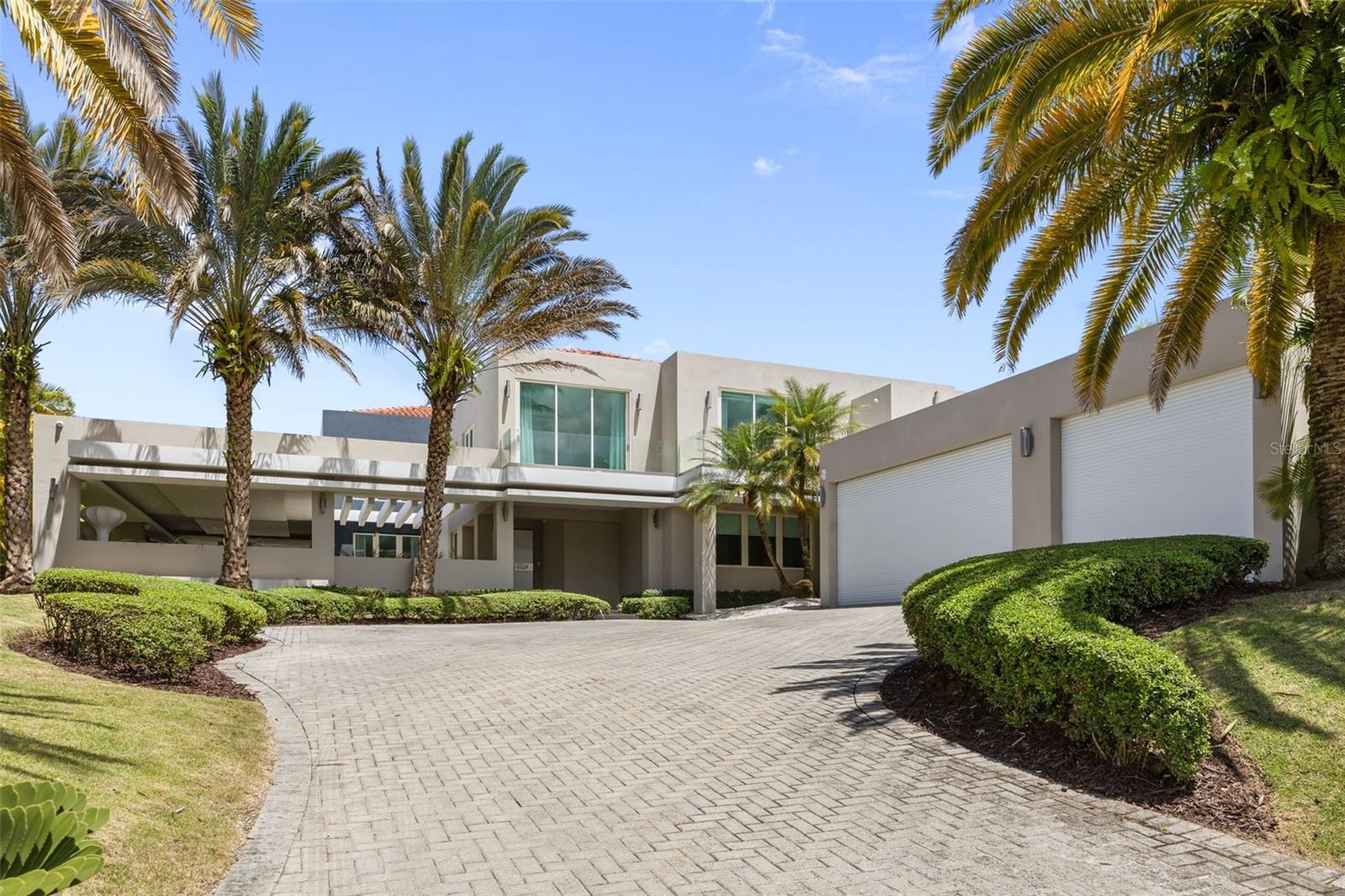 Located within the exclusive community of Dorado Beach East, this exceptional property offers luxury, privacy, and breathtaking surroundings in one of Puerto Rico’s most sought-after resort communities. Spanning approximately 8,000 square feet, the residence features 6 spacious bedrooms, each with its own ensuite bathroom, thoughtfully designed for both comfort and elegance. The home welcomes you with high ceilings and expansive living spaces. The outdoor area features a beautiful pool and terrace, perfect for entertaining while enjoying the serene surroundings. A private movie theater adds an elevated entertainment experience, while a separate detached structure currently configured as a gym provides additional flexibility and functionality.Designed to maximize privacy, the property enjoys no front neighbors and features beautiful lake views from the spacious primary suite. The primary bedroom retreat also features a generous walk-in closet.Located within the renowned gates of Dorado Beach East, this residence combines exclusivity, luxury, and resort-style living just moments away from world-class amenities, golf courses, beaches, and the Dorado Beach Resort.