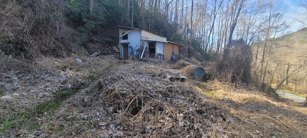 Discover the potential of this 6-acre parcel, offering stunning sloped terrain and ample road frontage. Located in an area abundant with outdoor opportunities, this property features a power pole on-site and some building materials (quantity and condition not guaranteed). Please note that the existing building is unsafe for interior viewing and is being sold AS-IS.  Seize this chance to invest in your own piece of nature! Contact us today for more information.