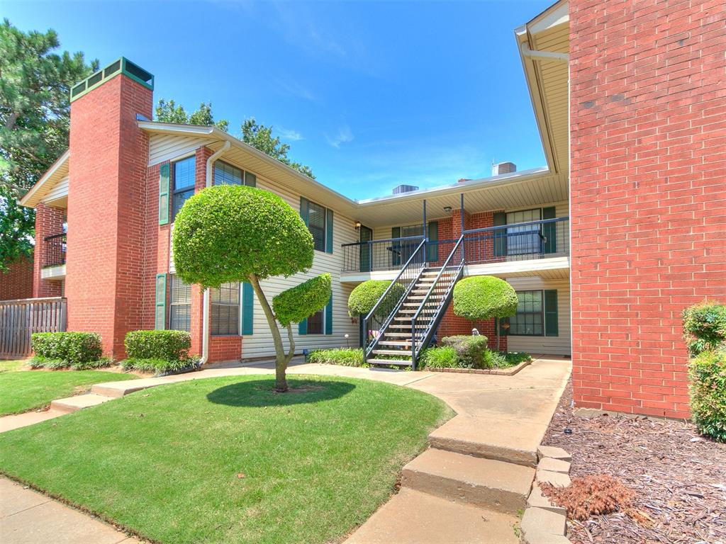 Discover the charm of this captivating 2-bedroom, 2-bathroom condominium showcasing an open, bright floor plan with views of the community pool and well cared for landscaped grounds. The spacious living room, complete with a wood-burning fireplace, has a convenient wet bar area which could be converted to a small study area. The dining has a breakfast bar and views through the double doors to the balcony. The kitchen, with pantry and a greenhouse window, has neutral colored cabinets and counters with beautiful shell textured backsplash around the range. Includes stainless steel faucet & dishwasher. You can retreat to the expansive Primary Suite offering 2 walk-in closets and a full bath with soaking tub, and toilet room with shower. This well-maintained unit has thermal windows, wood-look flooring and tile floors throughout the home. Embrace the ease of living with your HOA dues covering gated entry, community pool access, exterior insurance and maintenance, landscaping, water, trash, and a covered carport for your vehicle. Additional parking is available for your guests' convenience. This fabulous condo is located just off I-44 and Penn, with effortless access to Broadway Ext, Hefner Parkway, Penn Square Mall, and Classen Curve. Hemingway Condos are currently unavailable for investors since they must be owner occupied.