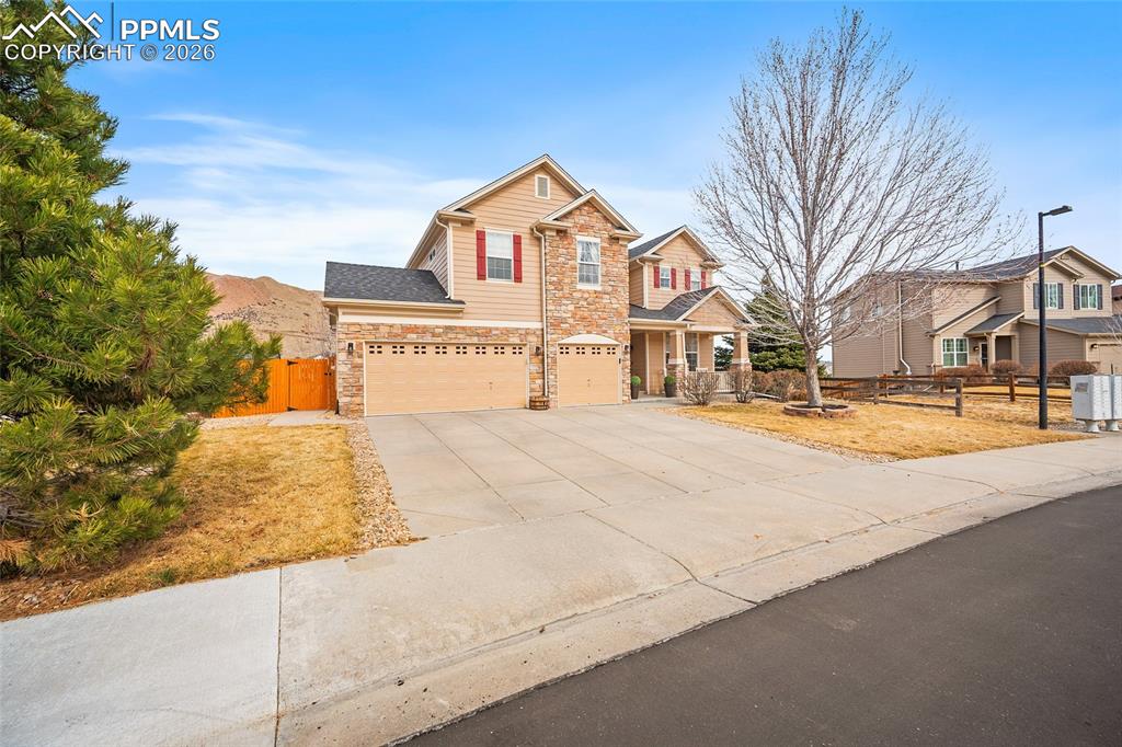 Greenbelt lot with finished walk-out basement in Castle Rock! This spacious two-story home offers 3,662 finished square feet, a three-car garage, and a rare lot that backs and sides to open greenbelt, providing added privacy and peaceful views. Inside, soaring two-story ceilings in the family room and expansive windows bring in abundant natural light. Hardwood floors and modern finishes highlight the main level, while the eat-in kitchen features granite countertops, a center island, pantry, and generous cabinet space. The kitchen opens to the family room with a cozy fireplace, creating a comfortable space for everyday living and entertaining. A main-level bedroom offers flexibility for a home office or guest room, and main-floor laundry adds convenience. Upstairs you’ll find new carpet, a versatile loft, two secondary bedrooms, and a spacious primary suite with a five-piece bathroom. The finished walk-out basement expands the living space with room for a recreation area, media room, gym, or game space. Outdoor living includes a deck off the main level and a covered patio below overlooking the greenbelt. The three-car garage provides excellent storage, and the south-facing driveway helps snow melt faster during Colorado winters. Additional highlights include no metro district and low HOA fees. Convenient Castle Rock location with easy access to I-25 via Wolfensberger Road or Plum Creek Parkway for commuting to Denver, the Denver Tech Center, or Colorado Springs. Enjoy the Castle Rock lifestyle with close proximity to Phillip S. Miller Park, the Miller Activity Complex, the Castle Rock Incline, miles of trails, and the future Castle Rock Sports Complex planned for 2027.