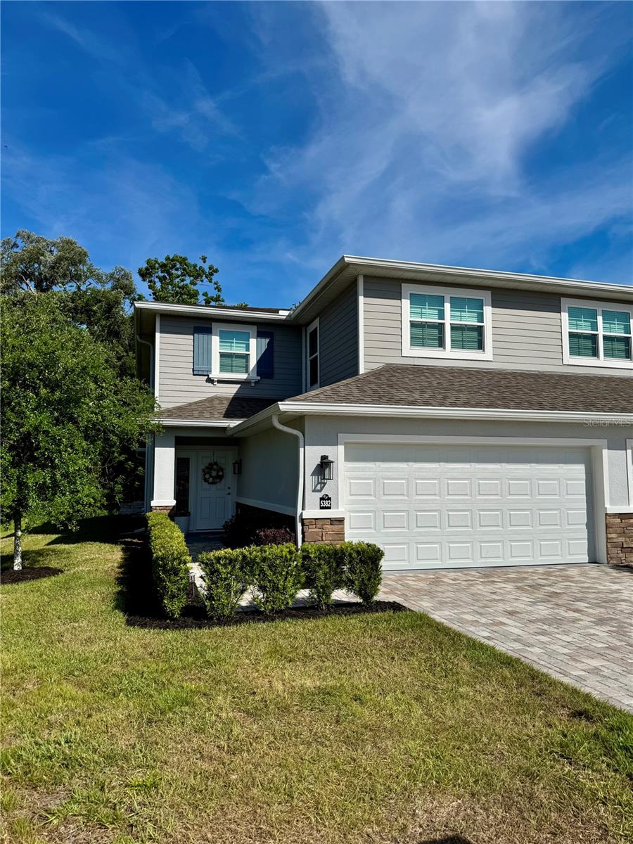 Welcome to 5382 Riverwalk Preserve Drive—an elegant 3BR/3.5BA home with NO 2024 storm damage, NOT in a required flood zone, and NO CDD fees. All windows, sliders and garage door are PGT hurricane-rated impact resistant for peace of mind.The light-filled main level features an open-concept layout with spacious living/dining areas and a well-appointed kitchen. Large sliders open to a screened lanai with preserve views—perfect for relaxing or entertaining. The main-floor primary suite offers private lanai access, an en-suite bath, and three closets including a walk-in.Upstairs you’ll find two additional bedrooms, each with their own bathroom and walk-in closet, plus a bonus room ideal for office/media/flex space. The home was built with over $50K in upgrades and includes a 2-car garage and ample storage.Riverwalk Preserve offers a scenic riverwalk trail along the Cotee River for walking, kayaking, fishing, and wildlife viewing. Just 3 miles to downtown New Port Richey, 20 miles to world-class beaches and Tampa International Airport, and close to Trinity’s shops, dining, and medical facilities.Move-in ready and designed for peaceful Florida living.