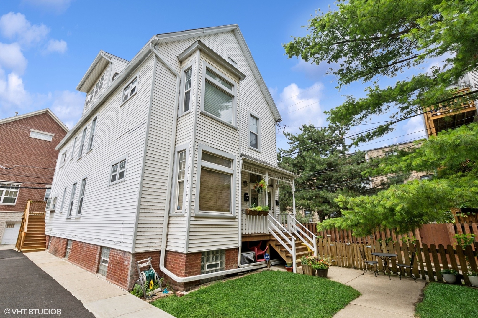 Welcome home! This a highly sought after and unique property situated in beautiful Ravenswood. Showcasing an abundant amount of natural sunlight throughout, you won't want to miss this one. Nestled behind the main condo building you'll enjoy the privacy and serene yard, tucked away in a perfect location. This very spacious duplex, approximately 2000sqft, feels like a single family home. As you enter the front foyer and make your way upstairs you'll be greeted into a darling landing area, the main level consists of high ceilings, a sitting room complete with gas fireplace, a large living room with bay window overlooking the center yard and a separate dining room, making this an ideal entertaining space. Additionally on the main level there are 2 nice sized bedrooms, one full bath with shower/tub combo, a recently refreshed kitchen with a deck perfect for grilling and in unit stackable washer and dryer. The kitchen has maple cabinets, granite counter tops, an island, stainless steel appliances and darling greenhouse window. The second floor showcases a huge second family room, office area, a newly updated full bath with soaker tub/shower combo, a generous third bedroom used as the primary, which also has a balcony off the back, tons of storage, beautiful skylights that make this space bright and beautiful. This home is located on a beautiful tree lined street near Winnemac Park, Schools, the EL, Metra, grocery stores, restaurants & all the fun in Ravenswood, Andersonville and Lincoln Square. One deeded exterior parking space and storage included. Very well run association.