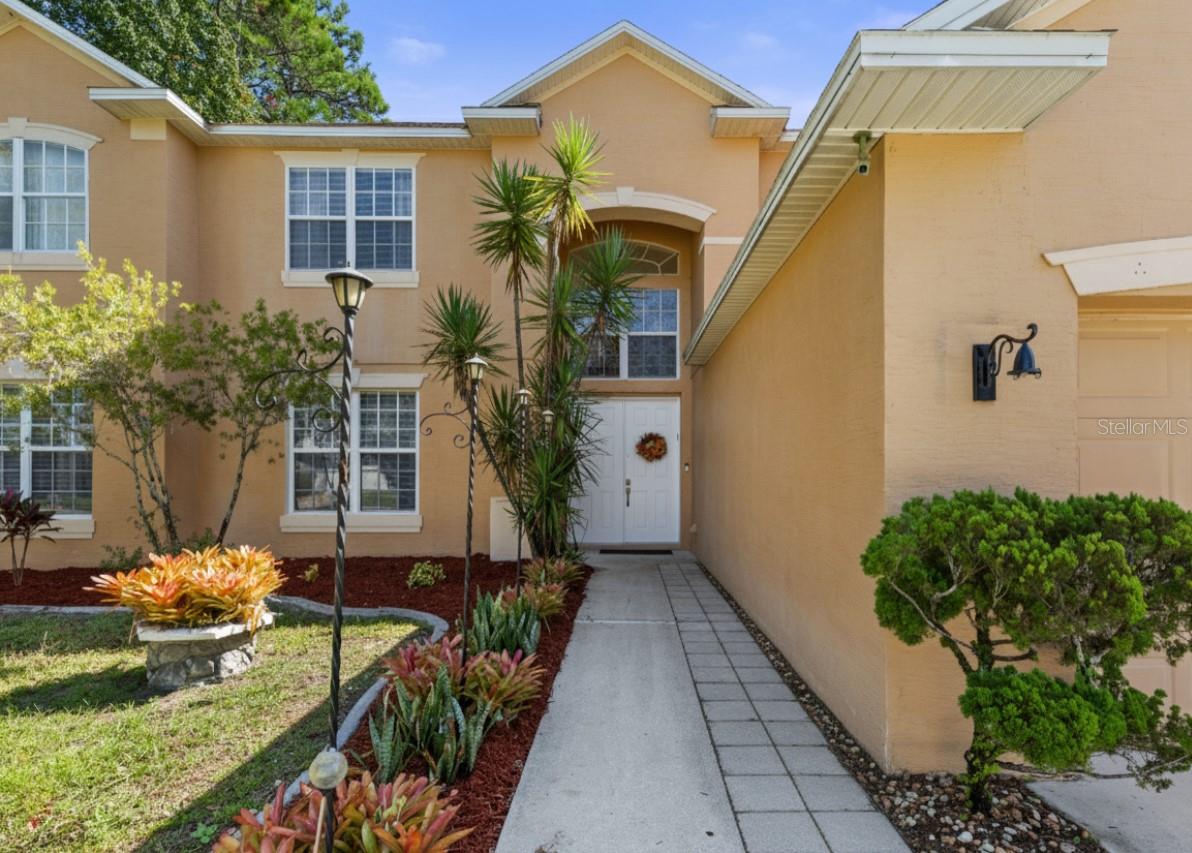 One or more photo(s) has been virtually staged. Welcome home to 38 Brewster Lane in Palm Coast — a spacious and inviting 6-bedroom, 3-bath pool home designed for comfort, flexibility, and modern Florida living.

With nearly 4,000 square feet of living space, this home offers room for everyone — whether you’re raising a family, welcoming extended relatives, or simply craving extra space to live, work, and relax.

Step inside and you’ll be greeted by soaring 20-foot ceilings and a light-filled open floor plan that instantly feels welcoming. The main floor features the Primary suite and a second bedroom, both with beautiful new ceramic tile flooring — ideal for multi-generational living or guests. Upstairs, you’ll find a versatile layout with multiple bedrooms, including one with a private sitting area and another with an efficiency setup, perfect for teens, in-laws, or visitors who want a little privacy.

The dual-access staircase adds architectural elegance, and the new carpeting installed in 2024 makes the upstairs feel fresh and cozy.

At the heart of the home is a fully remodeled kitchen — a chef’s dream — featuring soft-close cabinets, stainless steel LG appliances, a built-in oven, cooktop, and Samsung refrigerator. The spacious eat-in area is perfect for casual family meals or morning coffee with a view of the pool.

The Primary bathroom has been tastefully updated with fresh, modern finishes, adding to the home’s overall comfort and style.

Outside, you’ll love spending time in your private backyard oasis. The screened-in chlorine pool includes a child safety fence, new pump and filter, and is surrounded by a vinyl privacy fence — ideal for entertaining, relaxing, or watching the kids play. There’s even an oversized shed for extra storage. Triple sliding doors connect the indoor and outdoor spaces beautifully, allowing the Florida sunshine to flow throughout the home.

Enjoy energy efficiency with a 2023 roof and fully paid-off (at closing) solar panels, keeping average electric bills between just $80–$250 per month.

Location is unbeatable — you’re within walking distance to AdventHealth Hospital (about 13 minutes on foot or a 5-minute drive) and just minutes from shopping, dining, and local amenities.

If you’ve been searching for a large family home in Palm Coast with a pool, solar panels, and no HOA, this one truly checks every box. Come see why this home stands out for its thoughtful layout, modern upgrades, and unbeatable value.

(Buyer to verify all measurements and details.)