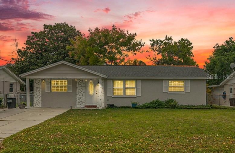 From the moment you walk in, you’ll notice how this 3-bedroom, 2-bath home combines modern updates with the easygoing charm of Florida living. Vaulted ceilings welcome you into a spacious light-filled living area that flows naturally into a separate dining room, perfect for entertaining or quiet family dinners. The kitchen has been tastefully refreshed with stainless steel appliances, shaker-style cabinetry with sleek modern pulls, and glistening granite counters that continue into both bathrooms for a cohesive polished look. With luxury vinyl plank throughout (no carpet), the home is both stylish and practical. The split-floor-plan places the primary bedroom privately on one side, where you’ll find a ceiling fan overhead, a generous walk-in closet, and a double-sink vanity to make mornings smoother. Outside, relax in the screened-in lanai overlooking the fenced backyard that includes a handy shed for extra storage. With a freshly installed roof as of December 2024, you’ll feel confident in both the interior and exterior of this home. Located in a no-HOA, no-CDD community, this property offers both style and freedom in one fully move-in ready package. And you’ll appreciate the convenience of daily living with a full-service Walmart Supercenter just a mile away on US 19. Public transit options are available nearby through Pasco County Public Transportation routes, and for regional travel, you’re only about a 40-minute drive into the Tampa area, making this both a tranquil retreat and a smart location for commuting. ***Ask about Pasco County down payment assistance options***