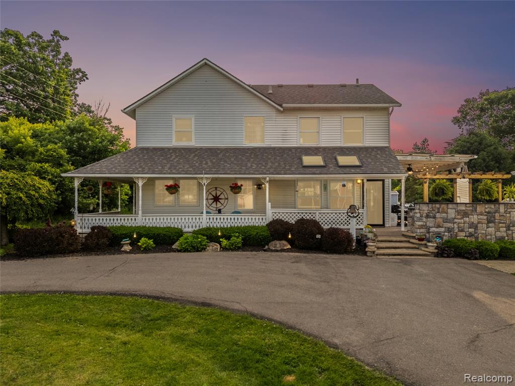 Unique opportunity awaits the buyer of this spacious farm style home located on over four acres of meadows. Prime location to live on the outskirts of the hustle and bustle, yet just off US-23, making it a wonderful setting to continue this established Hartland/Fenton daycare. House has lovely partial wraparound porch. Beautiful hardwood floors throughout the first floor and plenty of windows to welcome natural light. This 4,335 sq.ft. home offers an updated country kitchen with breakfast nook, which overlooks the pool deck and daycare center. Kitchen features dark brown cabinetry and beautiful dark tiled backsplash to match. Sliding glass door leads to the covered deck space. First floor laundry room for convenient living. Spacious living room features a massive floor to ceiling stone wood burning fireplace. Entry level den that could also act as a fourth bedroom. Second floor complete with primary master bedroom with luxury spa bathroom with a glass stand-up shower and tub. Plus, it's own wood burning fireplace. On the second floor, there are two additional bedrooms and two flex rooms that could act as bedrooms, plus a full bath. Expansive finished basement, adding 1,074 sq.ft. of living space. Wet bar area, perfect for entertaining, featuring a gorgeous floor to ceiling hardwood wall with matching bar. Plus, an additional room that could act as a bedroom, office, or flex space. Covered side porch and built-in grill area, featuring a tiki bar and above ground pool with wraparound deck. This backyard is a dream for Michigan summers and entertaining! Detached three car garage sits between the house and the daycare center. Established daycare center with a fenced-in playground area. Three classroom spaces, plus two baths and a kitchen. Large hay barn for storage or other use. Schedule your private tour of this dream-like home and daycare combination today!