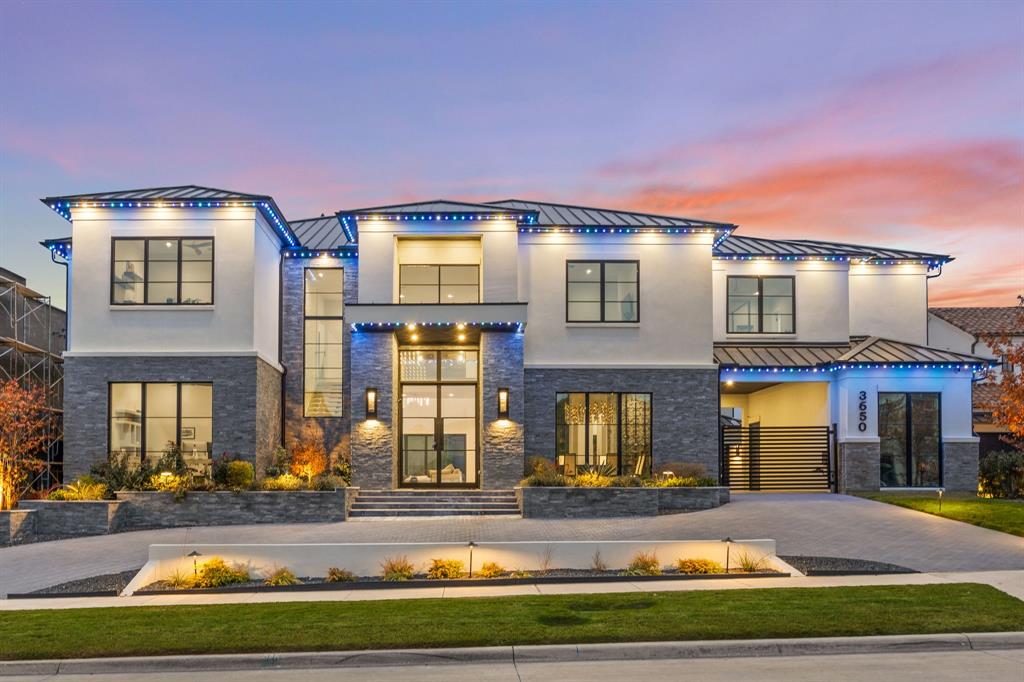 Achieve the pinnacle of luxury living at 3650 Balfour Court, a breathtaking modern estate located in the prestigious, gated community of The Hills of Kingswood in Frisco. Move-in ready and masterfully crafted, this 6-bedroom, 8-bathroom residence spans nearly 8,000 square feet and exemplifies contemporary sophistication, comfort, and design excellence. Step through grand 14-foot double doors into an expansive open-concept layout, where soaring ceilings and walls of windows flood the home with natural light. A sleek linear fireplace anchors the main living area, while a dramatic glass accordion door seamlessly connects the interior to the outdoor oasis. Custom contemporary chandeliers and recessed lighting set an enchanting tone from day to night. At the heart of the home is a show-stopping chef’s kitchen, featuring a massive 12-foot island. Top-tier Gaggenau appliances and integrated custom cabinetry for a sleek, modern aesthetic. The luxurious primary suite offers a tranquil retreat, complete with a spacious walk-in closet, dual vanities, a freestanding soaking tub, and an oversized rainfall shower—evoking a spa-like experience. Crafted with exceptional attention to detail, the home includes white oak flooring, designer finishes, and custom windows and doors throughout. Outside, enjoy resort-style living with a sparkling pool and spa, dramatic fire and water features, and ample space for entertaining or relaxing in complete privacy