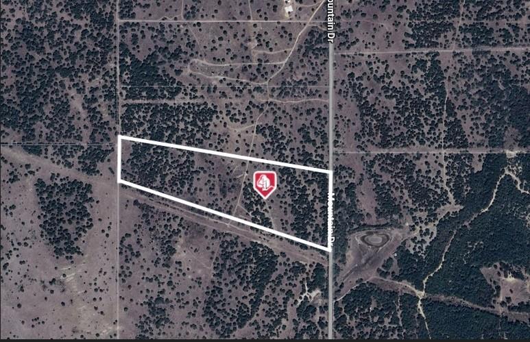Discover 26 Scenic Acres in Historic Palo Pinto County — Just One Hour from Fort Worth! Welcome to McClure Mountain Ranches, where 26 acres of pristine Texas countryside await your vision. Nestled in the rolling hills of northern Palo Pinto County, this property offers the perfect blend of natural beauty, rich history, and outdoor adventure—only an hour from Fort Worth. Teeming with wildlife and surrounded by panoramic views, this land is ideal for your dream recreational ranch, hunting retreat, or peaceful weekend getaway. The area is steeped in Texas lore—once a travel route for the Comanche and home to the legendary Goodnight-Loving Trail. Located just minutes from Possum Kingdom Lake and a short drive to Mineral Wells and Graham, you’ll enjoy easy access to small-town charm and outdoor recreation while preserving the privacy of wide-open spaces. With minimal deed restrictions in place, your investment is protected without limiting your freedom to build and enjoy. The property also benefits from a wildlife exemption, keeping property taxes impressively low and ownership hassle-free.