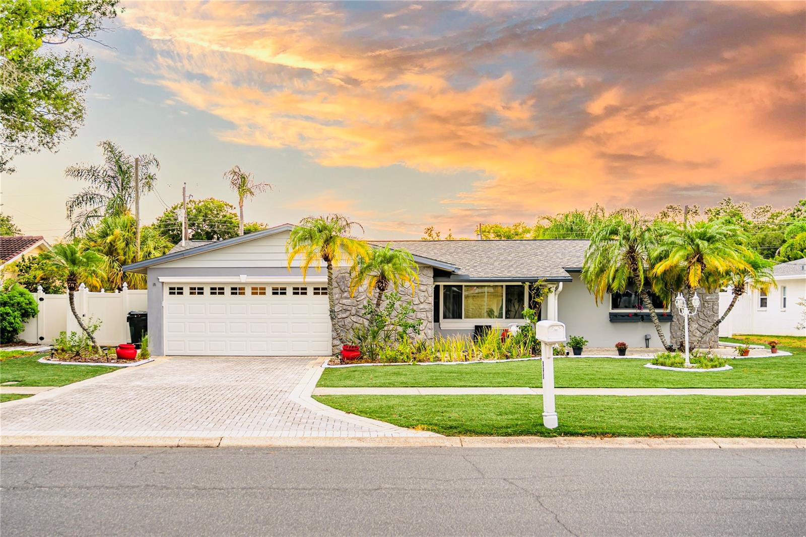 Welcome to your private oasis in the heart of Largo! This stunning, fully updated residence offers the perfect blend of modern luxury, peace of mind, and resort-style living. Step inside to discover a bright, open floor plan highlighted by a newly renovated chef's kitchen, complete with premium granite countertops and sleek stainless-steel appliances. No detail has been overlooked, including brand-new hurricane impact windows throughout the entire home for ultimate storm protection and energy efficiency. The ultimate highlight awaits in your backyard paradise. Escape to a spectacular heated pool and integrated spa, surrounded by premium synthetic turf that delivers a lush, luxury aesthetic with absolutely zero maintenance. Located in a highly desirable, central neighborhood, you are just minutes from the pristine Gulf Coast beaches, a short drive to the vibrant dining and culture of Downtown St. Pete and offer a seamless commute to Tampa International Airport. Located in a quiet and well-established neighborhood with NO HOA, this home offers both comfort and convenience. Enjoy being within walking distance to Eagle Lake Park, while supermarkets, pharmacies, restaurants, and shopping centers are just 5–8 minutes away.Additional features include a spacious 2-car garage, and short-term rentals (Airbnb) are allowed—making this property an excellent option as a primary residence, vacation home, or income-producing investment.Do not miss your chance to own this turnkey piece of paradise!