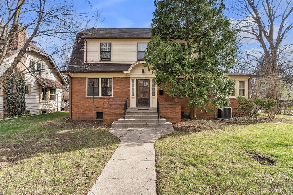 Welcome to this charming & loveable Dutch Colonial in the highly desirable Eberwhite neighborhood! You will immediately be struck by the gorgeous hardwood floors & the original wood French doors, trim & banister. Cozy up by the warmth of the woodburning fireplace in the winter, or relax in the sunroom with a good book. The spacious dining room gives you plenty of room for entertaining and you will enjoy the sunny kitchen! There is also a 1/2 bath on the 1st floor. On the 2nd floor you will find 3 bedrooms & a full bath. A true bonus is the fully insulated, finished attic space, which could be used as a study or a play/ game room. This space is not included in the square footage since it does not have its own heat source, but the sellers have used it regularly in every season. This lovely home sits on a large corner lot, with a deck out back & a two car garage. It is a very short walk to Eberwhite & Slauson schools, parks, the bus line & just over 1/2 a mile to downtown Ann Arbor.Home Energy Score of 1. Download report at a2gov.org/herdmap