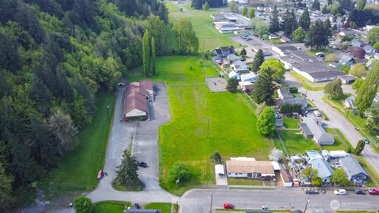 Rare opportunity w/this 6.21 acres of incredible potential to build 56-79 Single/Duplex/triplex homes at Base of Seminary Hill! Zoning allows mixed use, w/ flexibility to customize the neighborhood! Plan a full subdivision or phased build-out. These 3 parcels offer multiple building options for diverse market demand and max. land usage! These parcels are tucked away next to public school, at the end of the street, with all city amenities. Each lot accommodates private garages, sidewalks, separate yards, green belt shared space for walking to the Seminary Nature Trails, or connecting to school. Downtown is a few blocks away, in the Heart of Centralia. I-5 within 4-6 minutes. Central to Seattle and Portland.New Roof Installed on Building 2025