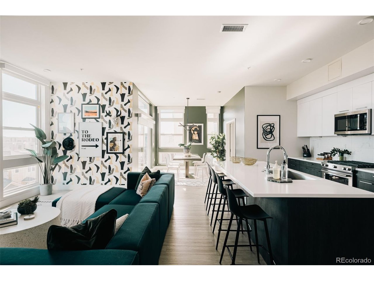 Stylish and sophisticated, this beautifully furnished 1,575 sq ft residence at the highly regarded Espadin offers exceptional LoHi living with breathtaking Denver skyline and Rocky Mountain views. Ideally located in one of Denver's most vibrant neighborhoods, you're just minutes from Mile High Stadium, Ball Arena, Coors Field, Meow Wolf, RiNo, and an incredible selection of restaurants, nightlife, art, and culture.The thoughtfully designed layout features an open-concept kitchen, spacious living area, formal dining room, and expansive windows that fill the home with natural light. A balcony extending the living space outdoors, while the rooftop deck offers stunning 360-degree city and mountain views. With space to comfortably sleep up to 10, this residence offers flexibility as a full-time home, part-time city retreat, or lock-and-leave residence.For those interested in generating income, Espadin is zoned for short-term rentals and includes a fully transferable hotel license, allowing for non-owner-occupied, short-term rental use. The property is being sold fully furnished. For additional information, please contact me. This has been a full time Airbnb and we have performance reports to share should you be interested in doing short-term rental.