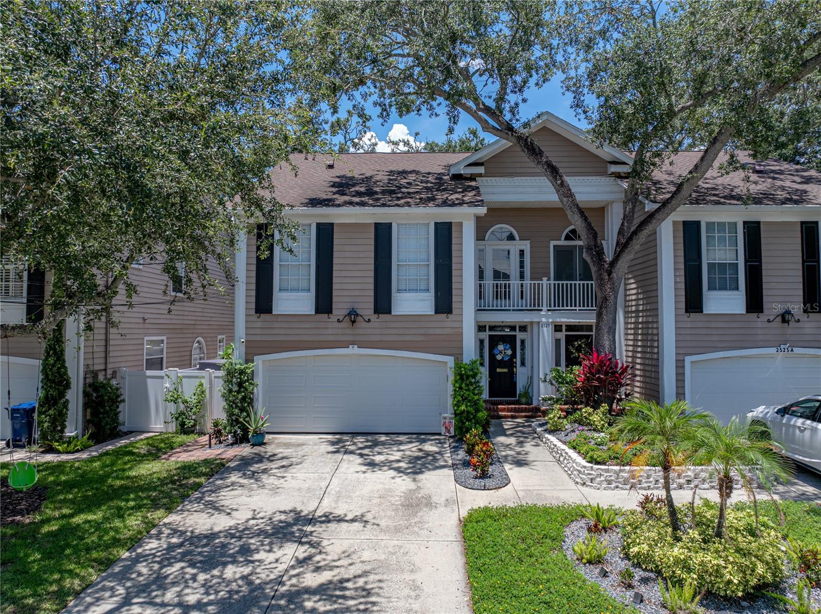 Perfectly located steps away from Bayshore Blvd and a short drive from South Tampa’s most sought-after destinations – Hyde Park Village, SOHO, Downtown Tampa and more. This stunning townhome presents a unique opportunity for elevated living with unmatched convenience. Thoughtfully designed across almost 2,000 sq ft, this 3-bedroom, 2-and-a-half-bathroom home is modern elegance and a curated sense of style. The fully renovated kitchen is a culinary dream, showcasing quartz countertops, custom cabinetry, a grand island, walk-in pantry, stainless steel, smart, gas appliances and ample storage. Luxury vinyl flooring compliments the vaulted ceilings and abundance of natural light throughout the home. A stunning fireplace elegantly connects the living and dining room, offering the perfect ambiance and touch of sophistication in the great room. The primary bedroom offers a serene retreat featuring an ensuite bathroom with a dual vanity, water closet, walk-in shower and walk-in closet. The upstairs loft is ideal for a home office, media lounge, play space or reading nook. Additional highlights throughout the home include a Brilliant Smart Home System, custom, built-in bar with dual keg taps, upstairs Jack-and-Jill bathroom with custom, gap, shiplap, laundry with full size washer and dryer and a spacious 2-car garage with ceiling mounted storage racks and Chamberlan garage door camera system. Outside, your private lounge awaits – a fenced in backyard with lush landscaping and an outdoor living space/pergola – perfect for quiet evenings or entertaining with loved ones. This impeccable residence offers luxury and lifestyle at its finest – it is truly a must see!