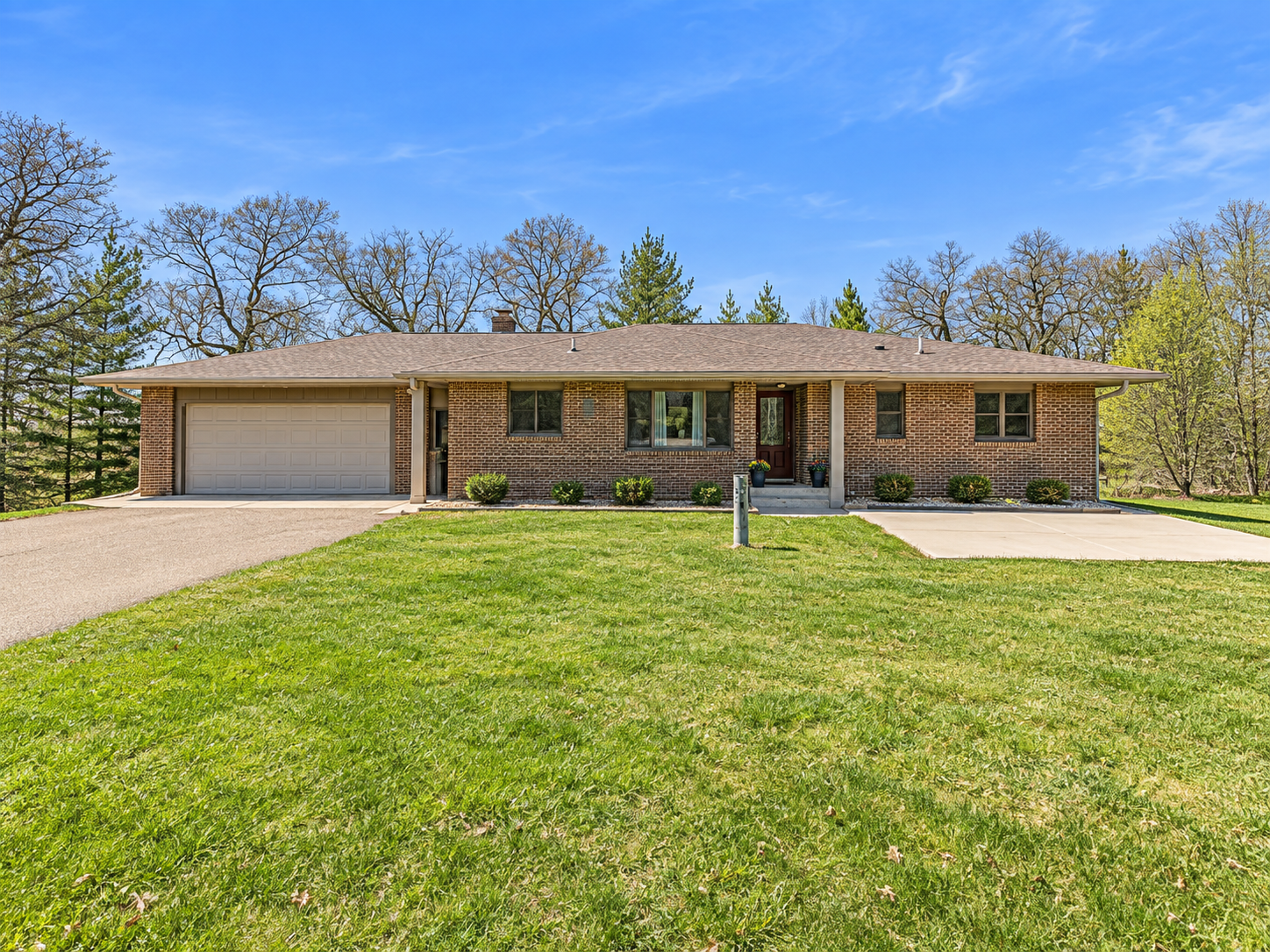 Don’t miss this incredible opportunity to own your dream country living home—9.84 acres in the 371 corridor offering peaceful surroundings with the convenience of being just minutes from town.The main floor features two bedrooms, including a massive owner’s suite designed for comfort and space, along with a full bathroom. You’ll love the inviting living room with a cozy fireplace, perfect for relaxing evenings, and a well-appointed kitchen ready for everyday living. The attached two-stall insulated garage adds practicality and year-round convenience.Downstairs, the home expands with three additional bedrooms, all equipped with new egress windows to provide safety and natural light. The spacious family room also features an egress window, creating a bright and welcoming gathering space, complete with its own fireplace. A second kitchen and laundry hookups on each level offer excellent flexibility—ideal for multi-generational living, guests, or potential rental opportunities.With its versatile layout, generous living spaces, and ideal blend of country charm and accessibility, this home is ready to fit a variety of lifestyles.This home has a new roof, all new Andersen Replacement windows & doors, insulated garage, new garage door, upgraded electrical, new furnace, concrete patio, and three new mini-split air conditioners for maximum comfort.  Receipts are available for review for all improvements if desired.