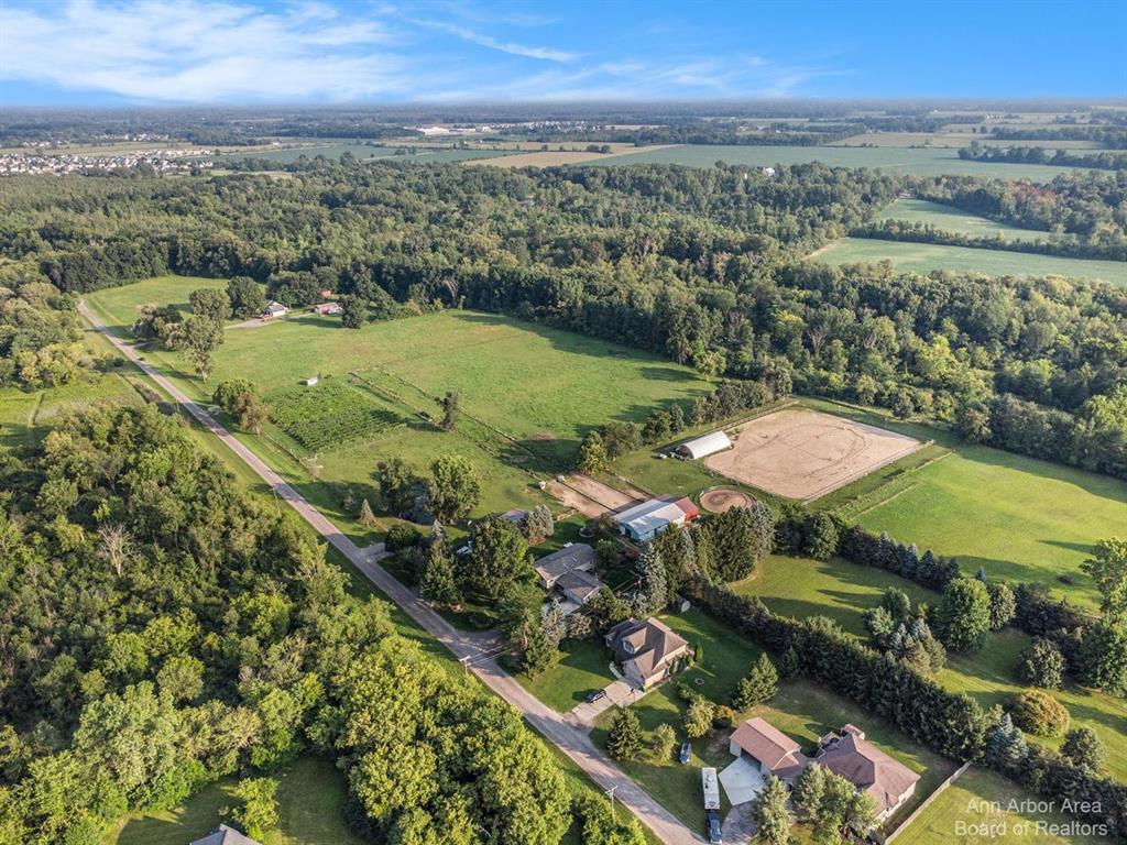 Wonderful development property in the path of future expansion. 80 acres of farmland and woods.   Perfect for a neighborhood with parks on two sides.