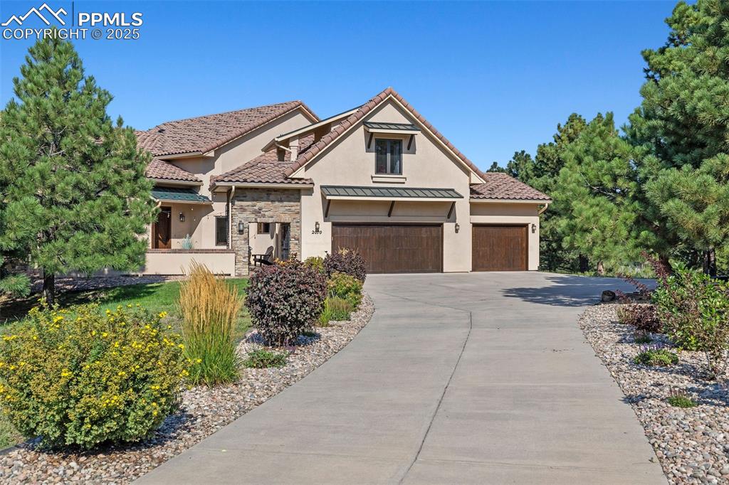 Spectacular Custom home w/ unobstructed views of Pikes Peak and Front Range. Rare location near Voyager & Interquest w/ a
private country feel. Gorgeous curb appeal w/ stucco & stone, wood beams, iron gate, concrete tile roof, and front courtyard w/
fireplace. Open floor plan w/ soaring ceilings, oversized tile flooring, incredible mtn views, formal dining, sun room, loads of
natural light, executive office w/ built ins, & gas fireplace. Gourmet kitchen features high level granite counters, solid alder
cabinets w/ hardware, designer tile backsplash, Bosch appliances, built in butcher block cutting board, 2nd prep sink w/
disposal, trimmed out imperial range hood, & Viking gas range. Master suite features Karastan Luxury Kashmere nylon carpet
with ½ inch 8-lb moisture barrier padding & mtn views. Attached 5 piece bath w/ hydromassage tub, spa walk in shower w/
rain head, tile flooring, separate sinks, and large walk in closet with his/her sides. Staircase w/ wrought iron spindles and
custom trim work. Upper level boasts large open loft open to main level & an amazing bunk room w/ balcony. Every bedroom
has an attached bathroom except for basement! Large walk out basement features wet bar, newer lvp flooring, & more mtn views!
Backyard is perfect for entertaining w/ large multi-level stamped concrete patio, stone walls, iron railings, turf play set area,
and loads of space. Kolbe windows and doors throughout. High end radiant heating system. Two Quiet Cool whole house fans for
the house & one for the garage. Large main level laundry w/ 2nd hook up in basement. Large storage room! Oversized 3 car
garage. MonierLife tile roof. Hunter Douglass window shades (some remote controlled). Newer well pump. Incredibly rare and
valuable location. County land so no rules on short term renting for extra income! Pride of ownership doesn't begin to tell the
story. Must see in person!