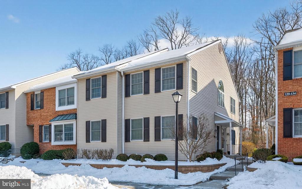 Welcome to 141 Chalkboard Court, a beautifully maintained second floor, end-unit condo in School House Mews. This freshly painted 2-bedroom, 2-full-bath home features gleaming hardwood floors throughout the living room, dining area, and hallway. Cathedral ceilings and large windows in the main living area fill the space with abundant natural light, creating an airy and inviting atmosphere.The kitchen offers a new stainless steel range and stainless steel dishwasher, while an Electrolux stackable washer and dryer are conveniently located in the utility room off the hall bath. The spacious primary suite includes a private en-suite bath with shower stall and an oversized walk-in closet. A second bedroom and full hall bath provide comfort and flexibility for guests or a home office.Enjoy the added privacy of an upper-level end unit with a balcony that backs to trees—perfect for relaxing and taking in the serene surroundings. Move-in ready and ideally located, this home is a wonderful opportunity in desirable Moorestown.