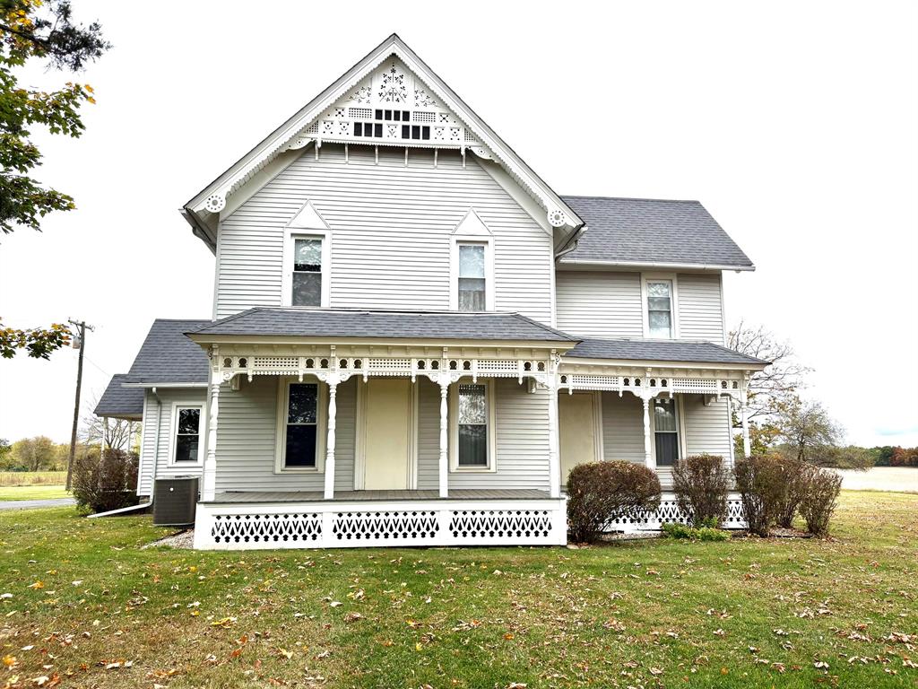Here is your opportunity to own a magnificent centennial home on over 10 acres.  This beauty does not show her age, so many updates including a remarkable kitchen, main floor bathroom, siding, windows, furnace and septic.  Amazing woodwork, pocket doors, moldings, built ins and vents that add to the old workd charm along with 6 exterior porches. (Trex flooring) and detailed trim work.  Totally unfinished 3rd floor along with area off of 3rd bedroom through the closet with endless possibilites.  Added perks outside include a 4 car garage, 40x64, 2005 pole barn, old barn that housed cows & horses back in the day with above loft.  Such a special home that offers so much tranquility.