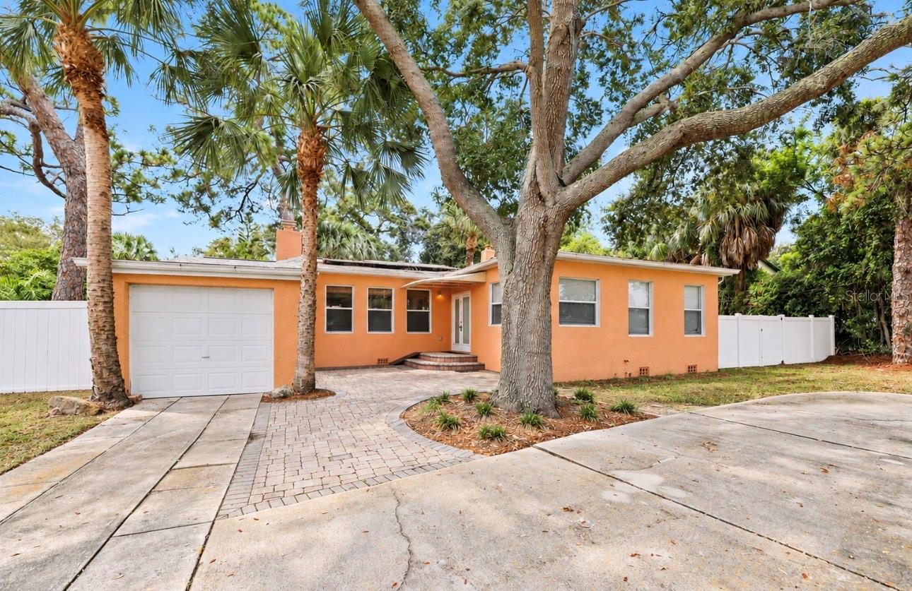 Welcome to 1559 Bayshore Boulevard, where an incredible location, an oversized double lot, and endless possibilities come together in one of Dunedin’s most desirable areas! Situated on approximately 1/3 of an acre, this unique property offers an exceptional amount of outdoor space while placing you just steps from some of the best that Dunedin has to offer.Enjoy the ultimate Florida lifestyle with Sunset Park and the Pinellas Trail just moments away, while vibrant Downtown Dunedin and beautiful Honeymoon Island are both just a short distance from home. Whether you love biking the trail, catching a waterfront sunset, spending the day at the beach, or heading downtown for restaurants, breweries, shopping, festivals, and entertainment, this location puts it all within easy reach.The home features 2 bedrooms and 2 bathrooms with spacious living areas and a comfortable, functional layout. Outside is where this property really stands apart. The expansive double lot provides an incredible amount of room to enjoy today while offering exciting possibilities for the future. The fully fenced yard creates a private outdoor setting with plenty of space for entertaining, pets, gardening, or creating your own backyard oasis.Sports enthusiasts will love the half-court basketball court, which can also function as a full-size pickleball court, making the backyard perfect for recreation and entertaining. A one-car garage provides additional parking and storage.Properties offering this much land in such a sought-after Dunedin location are increasingly hard to find. Whether you’re looking for a charming home with an oversized yard, space to personalize and expand, or simply an incredible piece of property close to the water, trail, parks, beaches, and Downtown Dunedin, 1559 Bayshore Boulevard is packed with potential and ready for its next chapter!