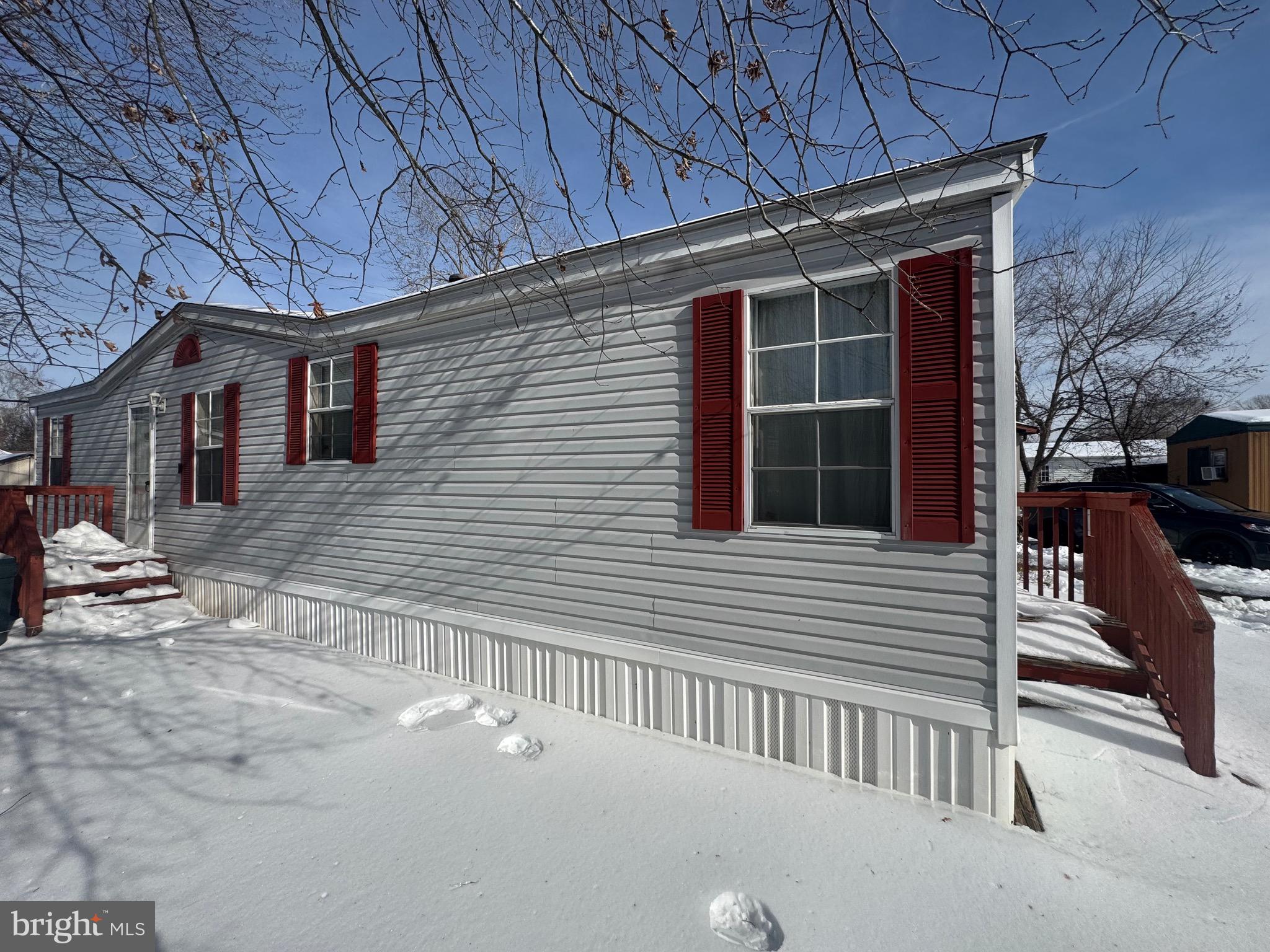 This Charming 3 Bedroom 2 Full Bath Double Wide Manufactured Home is Priced to Sell.  This open floor Concept Home boast LVP Flooring Throughout, Wood Burning Corner Fire Place in the Spacious Living Room, Dining Room with a bar/island adjoining the kitchen, Spacious Kitchen with Stainless Steel Stove and Refrigerator and dine in breakfast nook. Off the Kitchen is the Laundry room with washer and dryer. Master Bath Boast a nice size walk-in closet and in suite Master Bathroom with sunken tub and shower combination. As a resident of Patuxent Mobile Estates, you’ll enjoy fantastic community amenities including a boat ramp, tot lot, picnic area, and fishing pier access—Conveniently located with easy access to Annapolis, Washington D.C., Joint Base Andrews, Pax River NAS, nearby shopping, dining, and recreation—this affordable, move-in ready home is the perfect blend of comfort and lifestyle.Home was professionally leveled last year. Roof is less than two years new. Furnace recently cleaned and serviced.