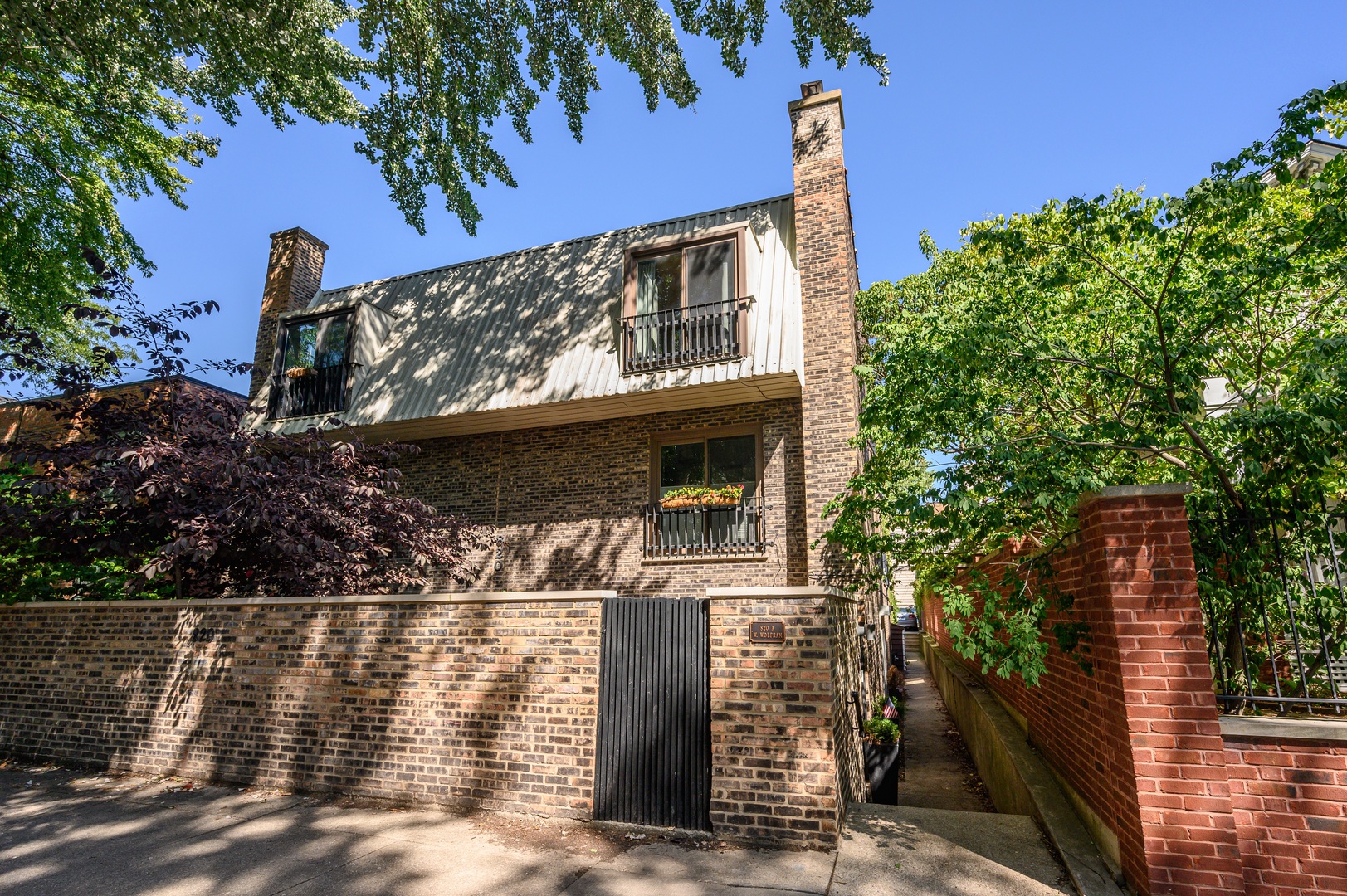 Beautifully updated brick townhome in a prime location! This fee-simple residence located in a side street but close to everything Lakeview/Lincoln Park and Downtown have to offer! Three spacious bedrooms plus a family room, combining comfort and style with modern upgrades throughout. The gourmet kitchen features granite countertops and a breakfast bar that opens to the inviting living room with a wood-burning fireplace. A formal dining area and large private patio make this home perfect for both entertaining and relaxing.   Enjoy updated bathrooms, In unit newer washer/dryer, organized closets, gleaming hardwood floors, custom paint, and a bright skylight. Central air conditioning and heat, and excellent interior and exterior storage add to the comfort and convenience. Assigned parking is included, and with no monthly assessments, this home offers outstanding value and move-in ready!  All of this in a fantastic neighborhood-just steps from restaurants, shopping, the lakefront, and public transportation.